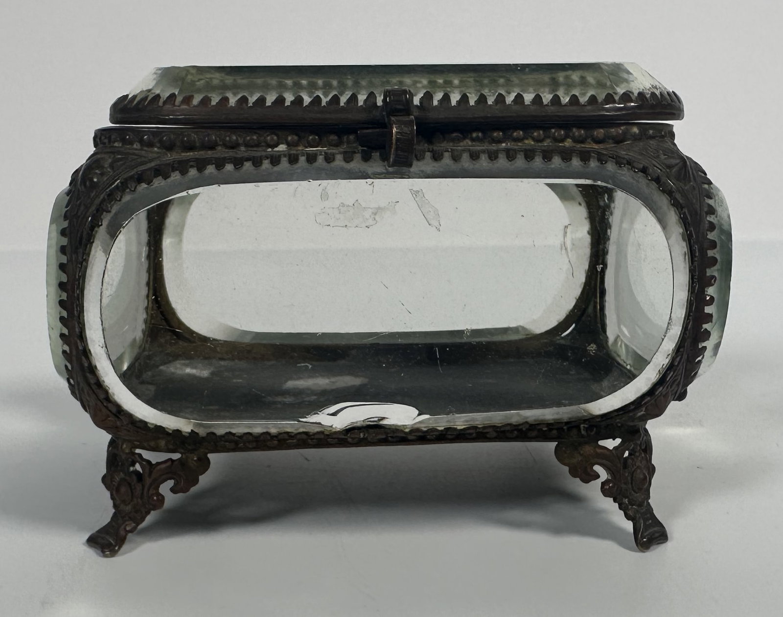 RR - Jewelry Casket - Gilt Metal, Rounded Beveled Glass: Jewelry Casket - Gilt Metal, Rounded Beveled Glass Classic French gold tone frame jewelry casket with beveled glass panels with rounded corners on a rectangular box. For this lot shipping can be done 
