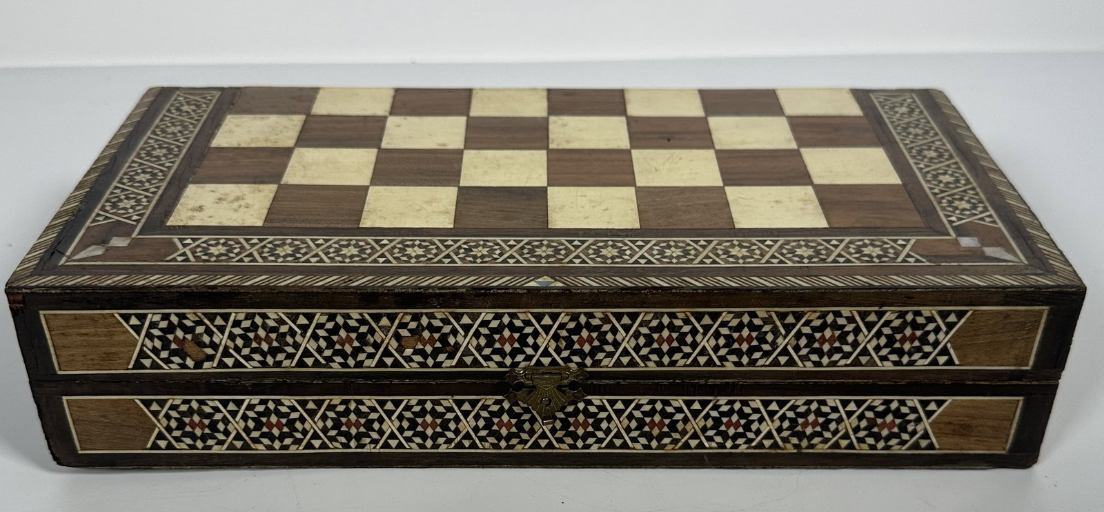Damascus Mosaic Backgammon and Chess Inlaid Box: Damascus Mosaic Backgammon and Chess Inlaid Box This is a traditional Damascus mosaic wood chess and backgammon board hand-inlaid with geometric marquetry patterns and mother-of-pearl accents. The fol
