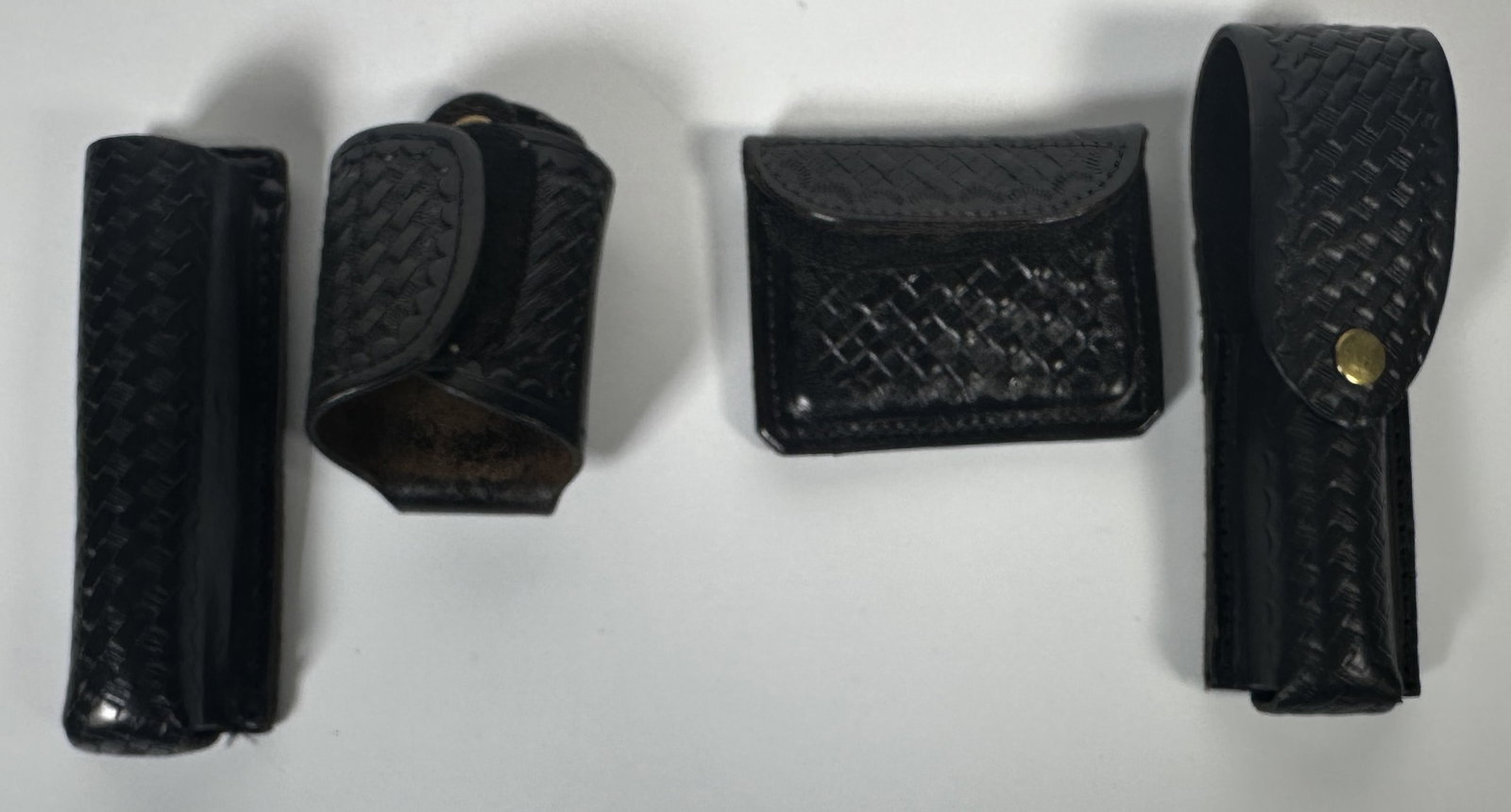 Basket Weave Pattern Leather Belt Clips, Holster: Basket Weave Pattern Leather Belt Clips, Holster This group includes a set of black leather basketweave police duty gear accessories, including a knife or flashlight holder, an OC/mace or pepper spray