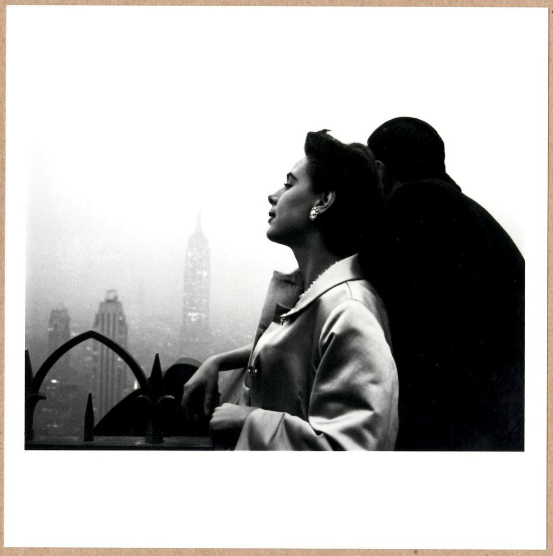 ESTATE STAMPED - EVE ARNOLD COUPLE ON A SKYSCRAPER OVERLOOK, NYC - LTD 6" x 6" MAGNUM ARCHIVAL: Description: 6"x 6" limited edition Fuji Crystal Archival Matte paper print. Image size is 5.5" on the longest side and the paper size is 6" x 6". The Print is ESTATE STAMPED on the verso.Condition: B