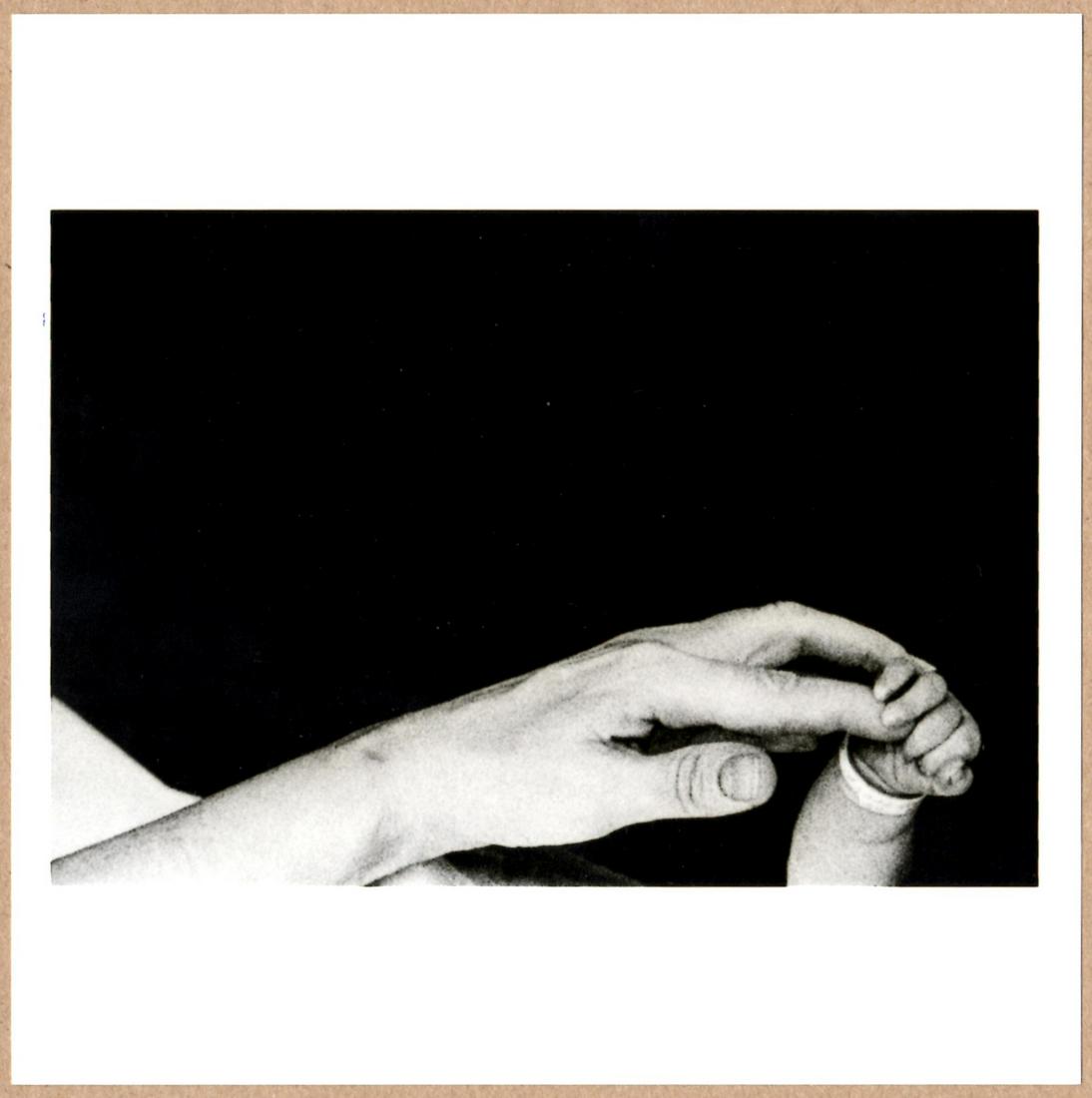 ESTATE STAMPED - EVE ARNOLD - A BABY'S FIRST FIVE MINUTES, 1959 6"x 6" MAGNUM PRINT. (1 of 2)