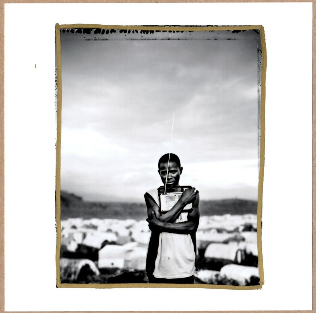 SIGNED - JIM GOLDBERG - PRIZED POSESSION (#2). REFUGEE CAMP, MUGUNGA, DEMOCRATIC REPUBLIC OF CONGO, (1 of 2)