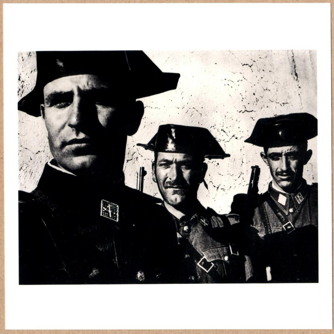 ESTATE STAMPED - W. EUGENE SMITH GUARDIA CIVIL, SPAIN 1951 6" x 6" MAGNUM PRINT.: Description: 6"x 6" limited edition Fuji Crystal Archival Matte paper print. Image size is 5.5" on the longest side and the paper size is 6" x 6". The Print is ESTATE STAMPED on the verso.Condition: B