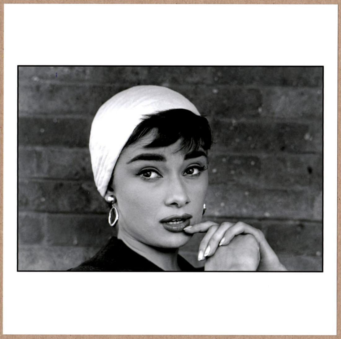 ESTATE STAMPED - DENNIS STOCK - AUDREY HEPBURN, LONG ISLAND, NEW YORK, 1954 LTD 6" x 6" MAGNUM: Description: 6"x 6" limited edition Fuji Crystal Archival Matte paper print. Image size is 5.5" on the longest side and the paper size is 6" x 6". The Print is ESTATE STAMPED on the verso.Condition: B