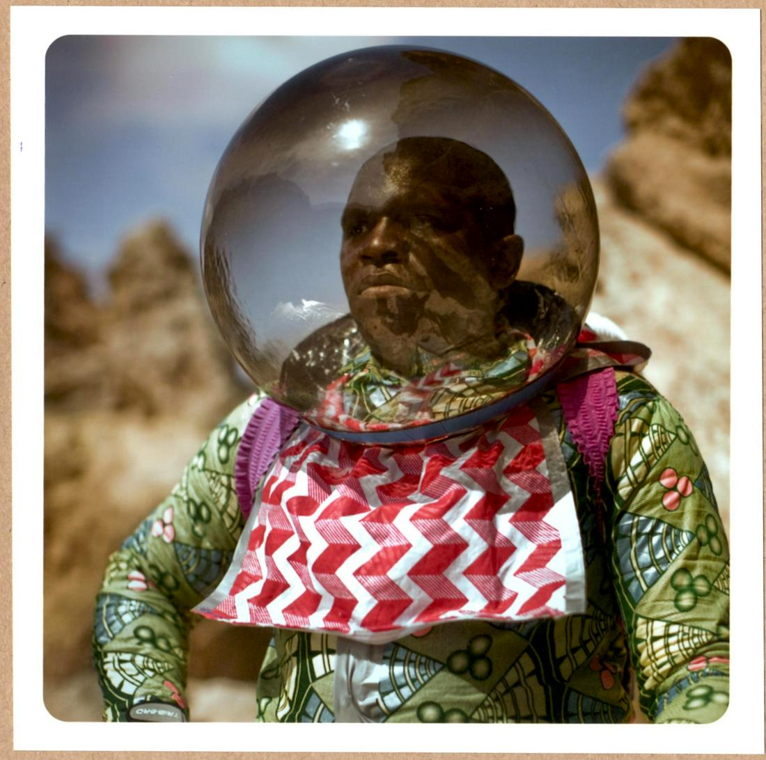 SIGNED - CRISTINA DE MIDDEL - DHANA, AFRONAUTS, 2011 LTD 6" x 6" MAGNUM PRINT.: Description: 6"x 6" limited edition Fuji Crystal Archival Matte paper print. Image size is 5.5" on the longest side and the paper size is 6" x 6". The Print is SIGNED by Cristina de Middel on the vers