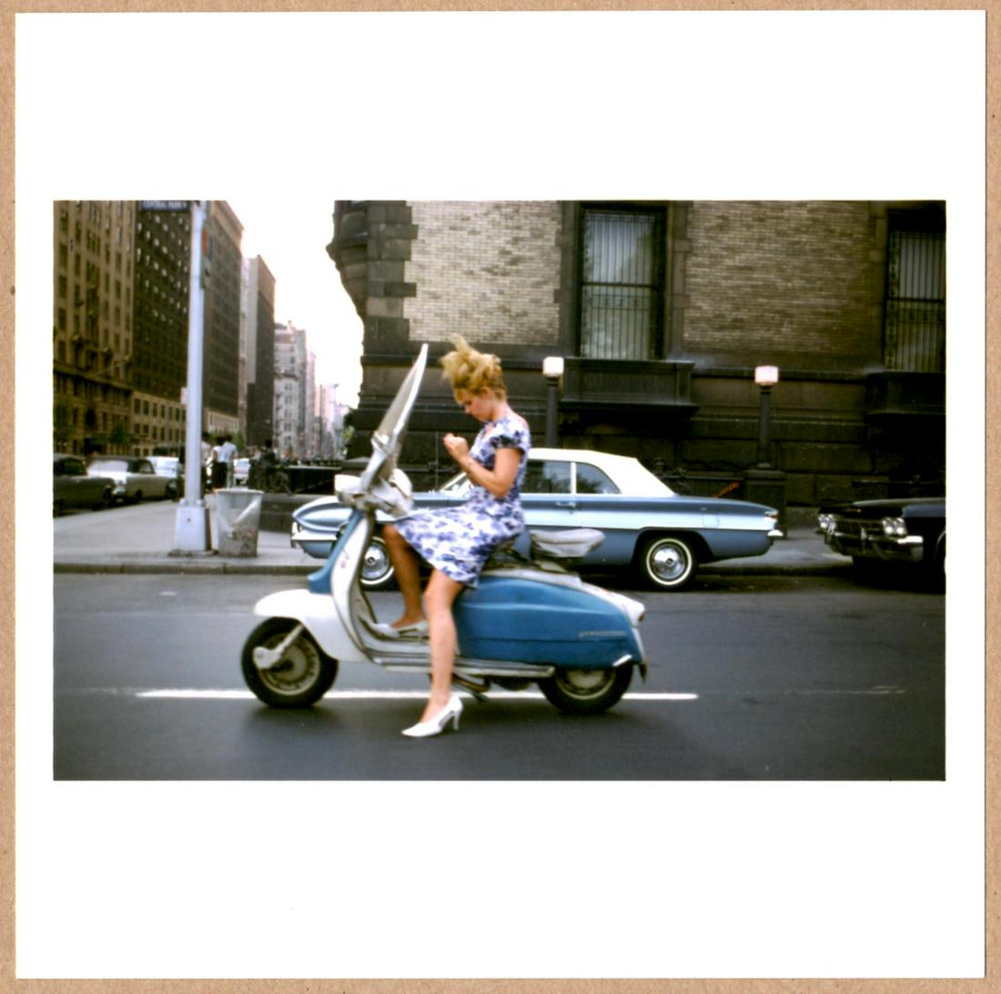 SIGNED - JOEL MEYEROWITZ - VESPA NEW YORK CITY 1965 - LTD 6" x 6" APERTURE PRINT.: Description: 6"x 6" limited edition Fuji Crystal Archival Matte paper print. Image size is 5.5" on the longest side and the paper size is 6" x 6". The Print is SIGNED by Joel Meyerowitzon the verso.Co
