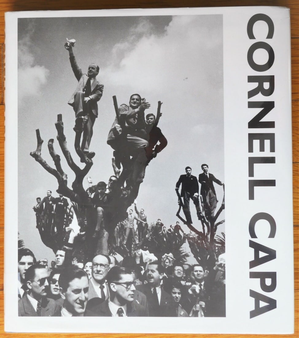 Capa, Cornell; Whelan, Richard; Cornell Capa Photographs [SIGNED PRESENTATION COPY TO CARL MYDANS -: Boston.: A Bulfinch Press Book, Little, Brown & Company, 1991. 4to. 216 pages with 179 duotone illustrations, mostly full-page, featuring a range of Capa's photojournalism. Foreword by Richard Whelan.