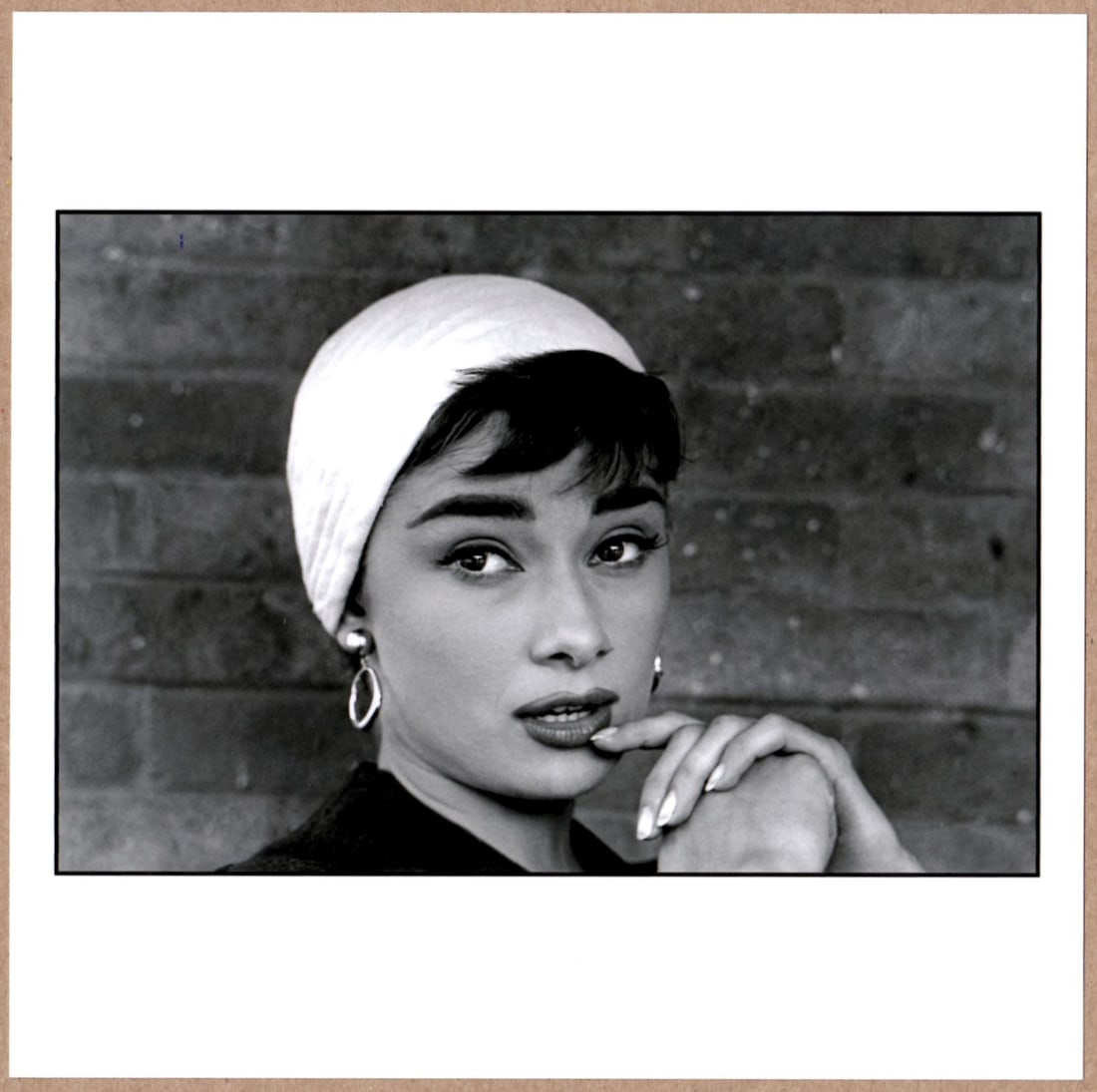 ESTATE STAMPED - DENNIS STOCK - AUDREY HEPBURN, LONG ISLAND, NEW YORK, 1954 LTD 6" x 6" MAGNUM PRINT: Description: 6"x 6" limited edition Fuji Crystal Archival Matte paper print. Image size is 5.5" on the longest side and the paper size is 6" x 6". The Print is ESTATE STAMPED on the verso.Condition: B