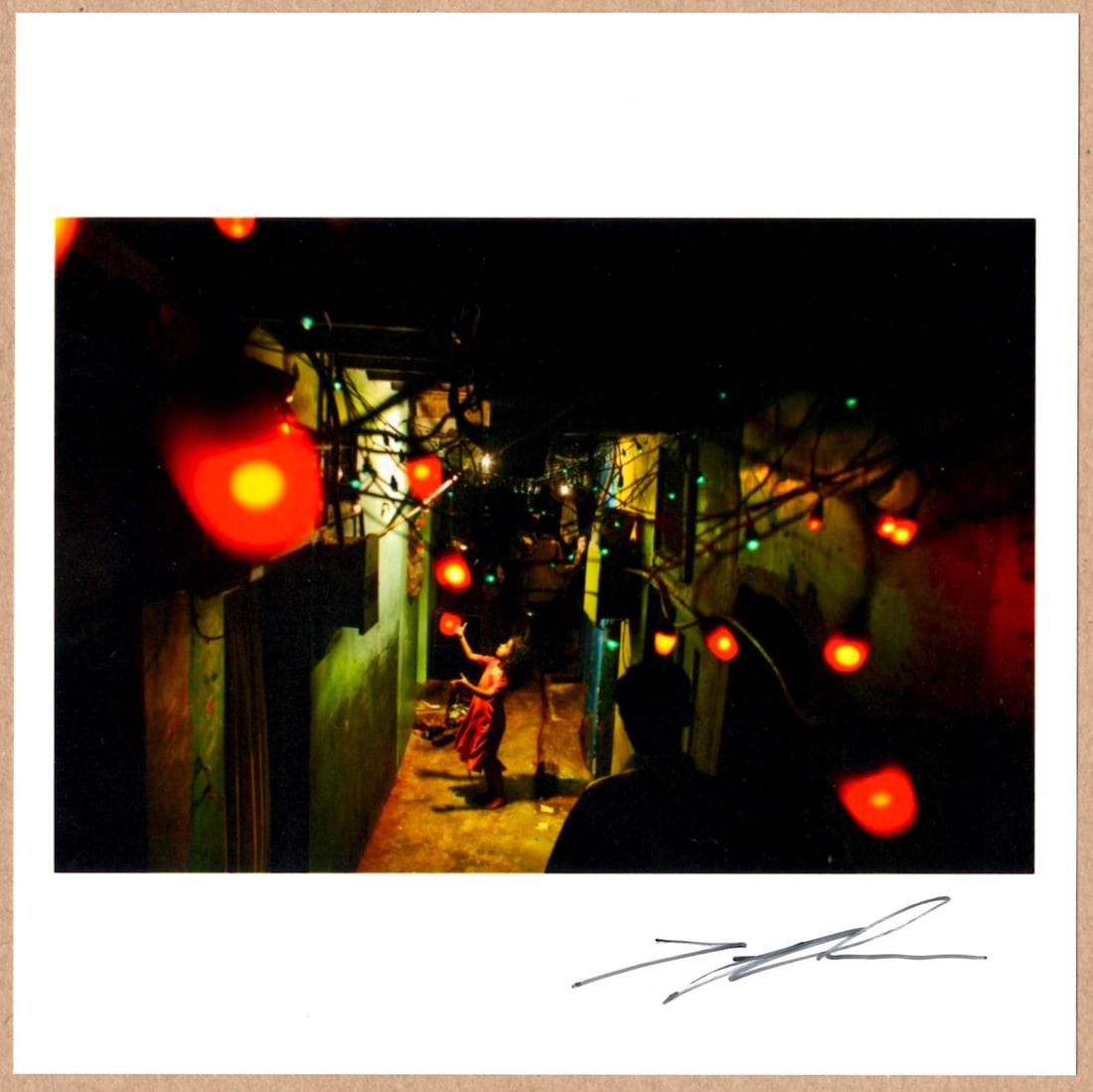 SIGNED - JONAS BENDIKSEN - COVER IMAGE FOR THE PLACES WE LIVE, WEDDING LIGHTS, MUMBAI, INDIA 6"x 6": Description: 6"x 6" limited edition Fuji Crystal Archival Matte paper print. Image size is 5.5" on the longest side and the paper size is 6" x 6". The Print is SIGNED by Jonas Bendiksen on the recto.C