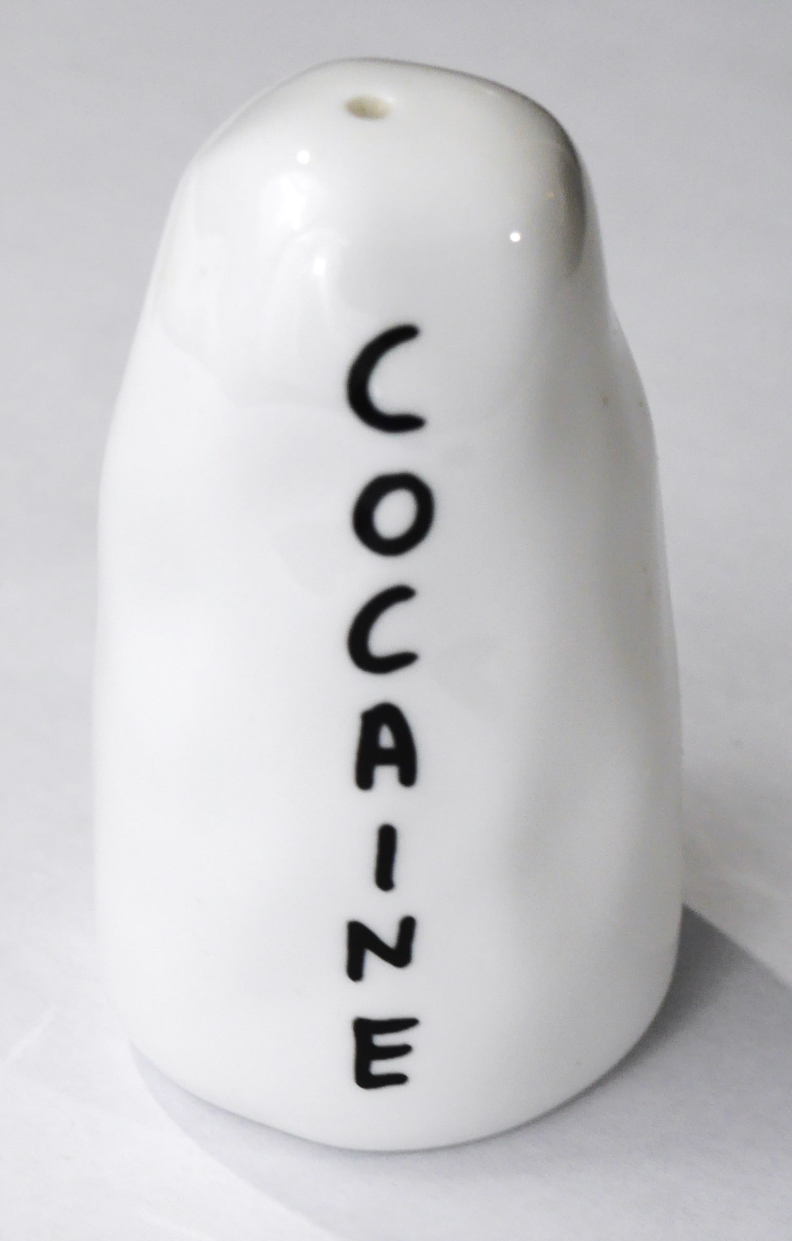 Shrigley, David; Cocaine Porcelean Salt Shaker [RARE 2008 1ST ISSUE - STAFFORDSHIRE SALT SHAKER: David Shrigley & Polite Company (produced by Staffordshire England), 2008. 1st issue Salt Shaker (Salt Shaker Only). A cult classic from David Shrigley, the Cocaine and Heroin Salt & Pepper shakers ar