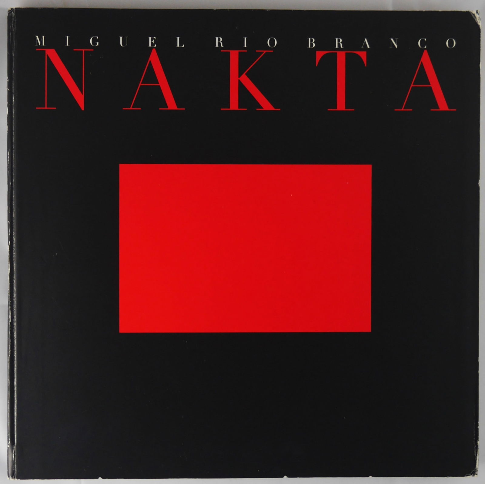 Rio Branco, Miguel; Nakta: Cultural Foundation of Curitiba, Brazil, 1996. Flexi cardboard covers with printed image as issued. First Edition, First Printing. Photographs by Miguel Rio Branco. Poem, 'Noite Fechada', by Louis Cal