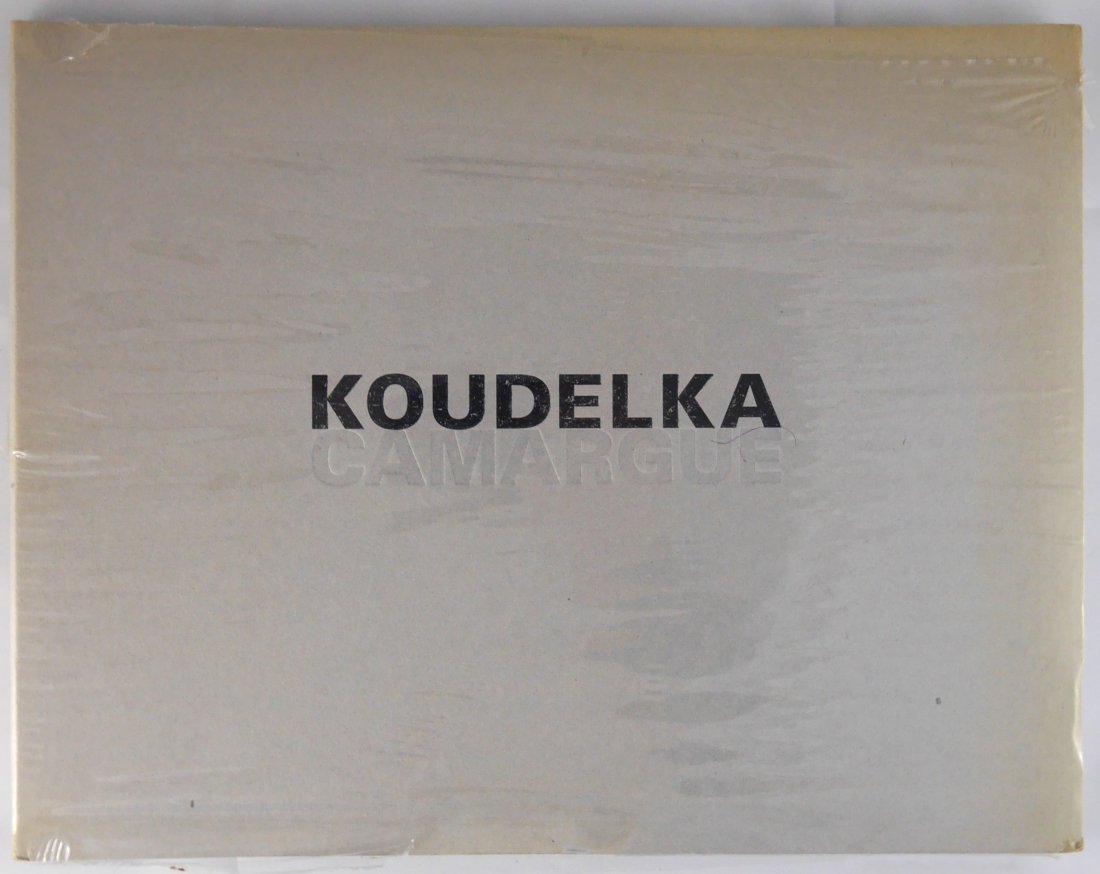 Koudelka, Josef; Camargue [2006 1ST EDITION & 1ST PRINTING - FINE COPY]: Paris: Actes Sud, 2006. Paperback in heavy card covers, leporello/accordion bound. First edition, first printing. 54 pages; b&w plates; 11.75 x 9.25 inches. Text in French. In this collection of panor