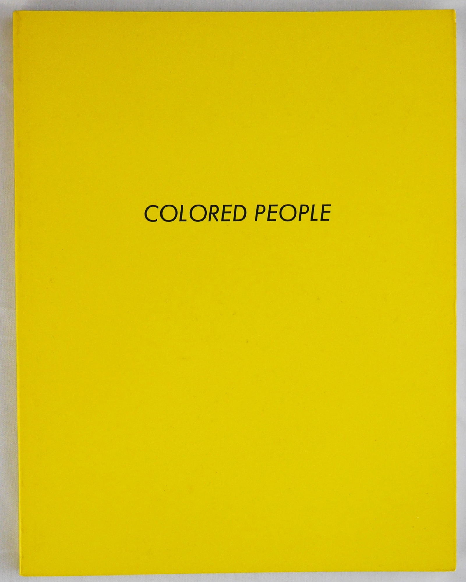 Ruscha, Ed; Colored People [1ST EDITION - FINE COPY]: Ed Ruscha, Los Angeles, 1972. Soft cover in yellow laminated wrappers. First edition. Unpaginated with 64 pages and 15 four-color plates. 7 x 5-1/2 inches. This first and only edition was limited to 4