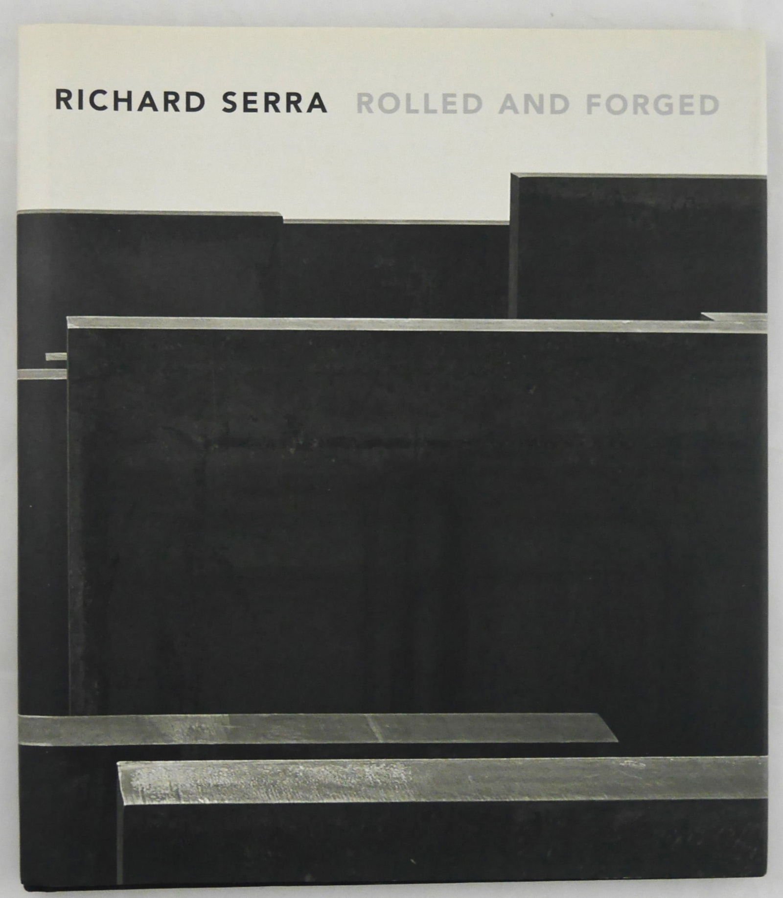 Richard Serra, Rolled and Forged [SIGNED 2007 GAGOSIAN MONOGRAPH]: Gagosian Gallery, New York, 2007. Hardcover in pictorial dust jacket. First Edition, First Printing. 10" x 11", 76 pages with 45 tritone illustrations with numerous black and white images of Serra's s