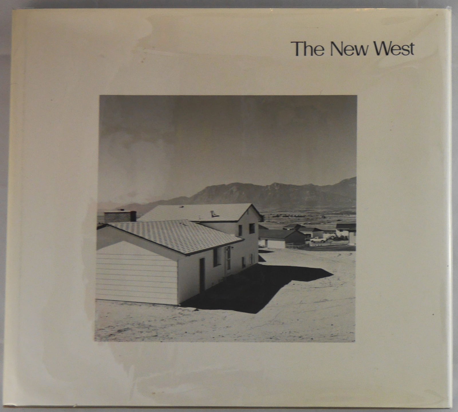 Adams, Robert, The New West [1974 1ST EDITION & 1ST PRINTING HARDCOVER WITH DUST JACKET - FINE COPY]: The Colorado Associated University Press, Boulder, Colorado, 1974. Hardcover in picorial dust jacket. First Edition, First Printing. 56 black and white plates offering an early photographic study of m