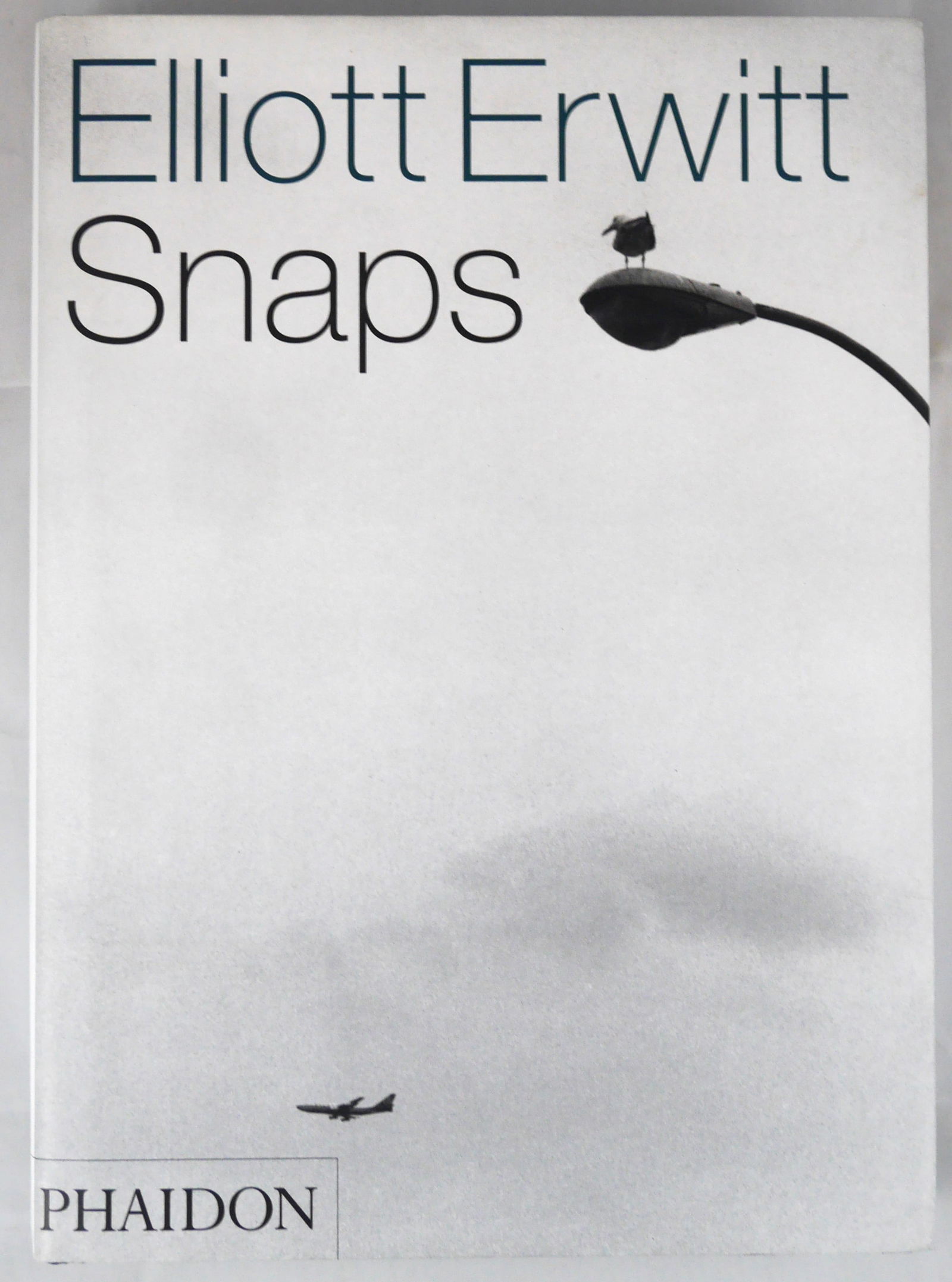 Erwitt, Elliott, Snaps [SIGNED - 2001 1ST EDITION & 1ST PRINTING HARDCOVER - FINE COPY]: SIGNED COPY New York and London: Phaidon, 2001. Hardcover in pictorial dust jacket. First edition, First Printing. 544 pages with numerous black and white photographic images throughout. SIGNED by Ell