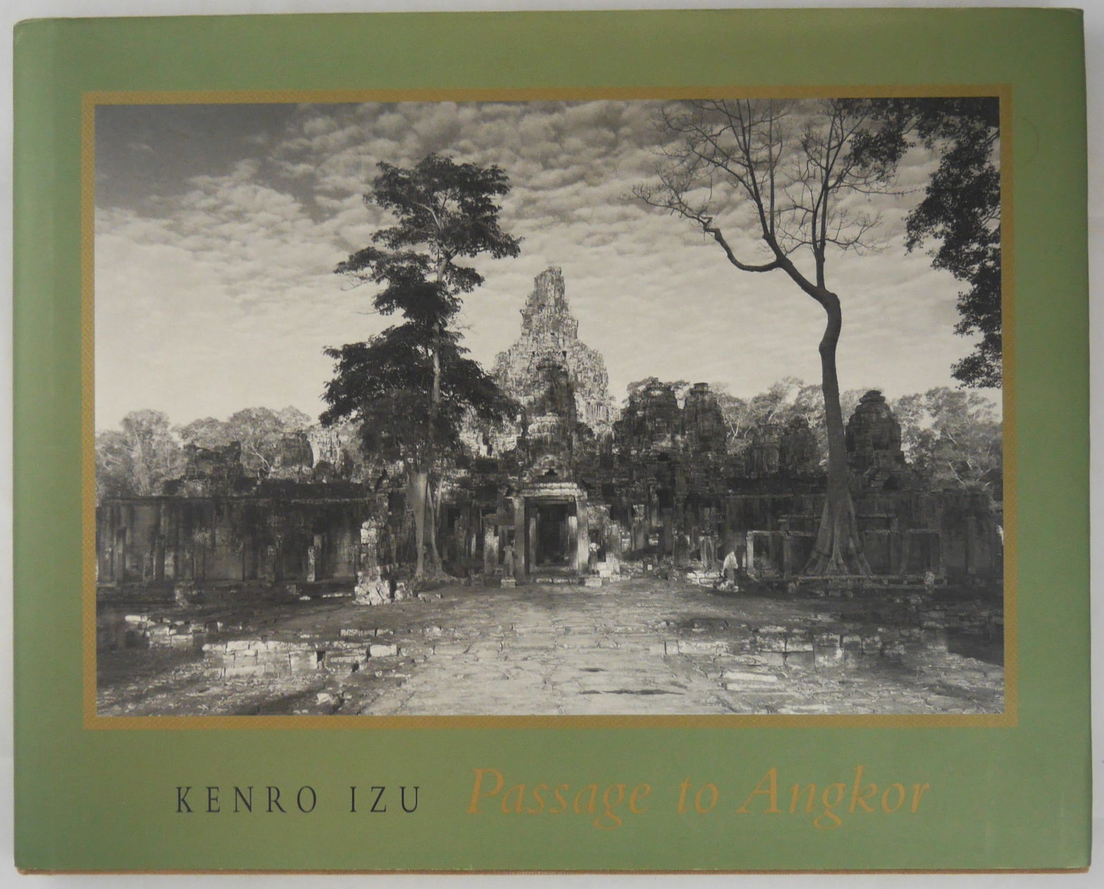 Izu, Kenro, Passage To Angkor [SIGNED - 2003 1ST EDITION & 1ST PRINTING - FINE COPY]: SIGNED COPY Channel Photographics, 2003. Hardcover in pictorial dust jacket. First edition, First Printing. Photographs by Kenro Izu. Introduction and poems by Helen Ibbitson Jessup. Designed by Elsa