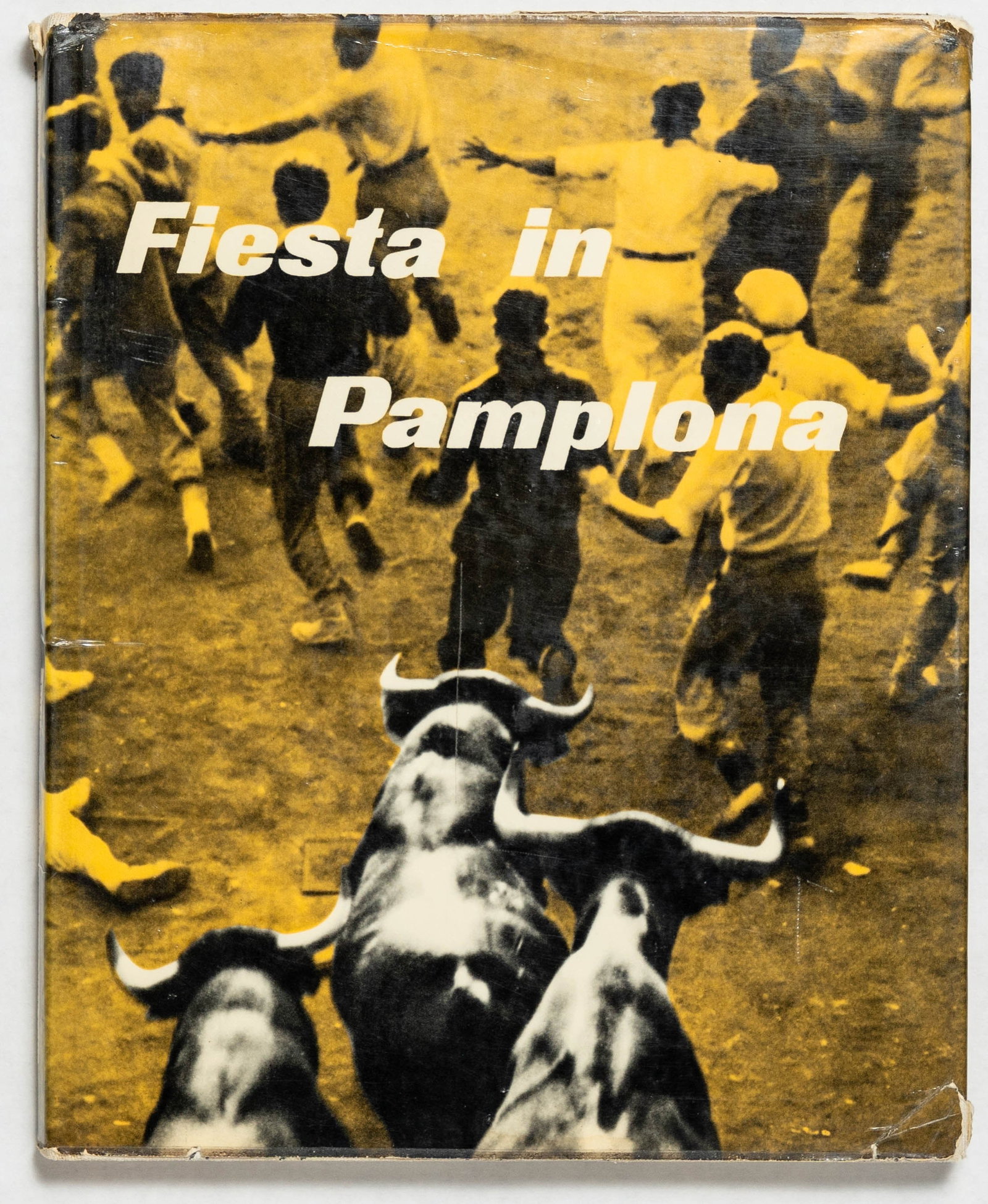 Morath, Inga [SIGNED]; Fiesta in Pamplona / Running of the Bulls [1956 1ST ENGLISH EDITION]: SIGNED COPY New York, Universe Books, 1956. Hardcover in pictorial dust jacket. First American Edition, First Printing (published one year after the first French edition, 1955). 129 pages with numerou