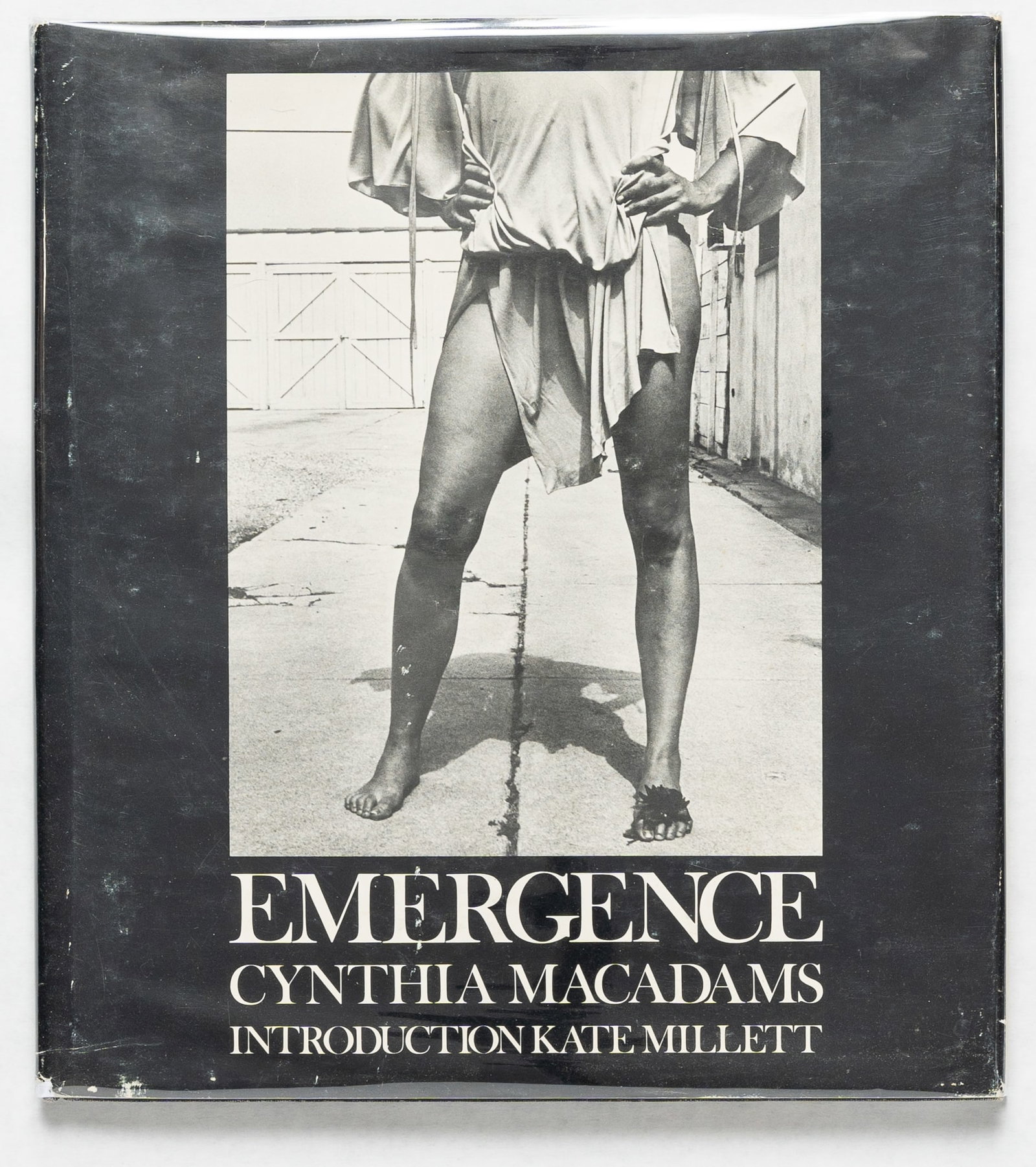MacAdams, Cynthia; Millett, Kate; Emergence [1977 1ST EDITION HARDCOVER WITH DUST JACKET]: Chelsea House, 1977. Hardcover in pictorial dust jacket. First Edition, First Printing. 10 x 9 inches. 120 pages with numerous black and white photographic images throughout featuring the "New Kind of