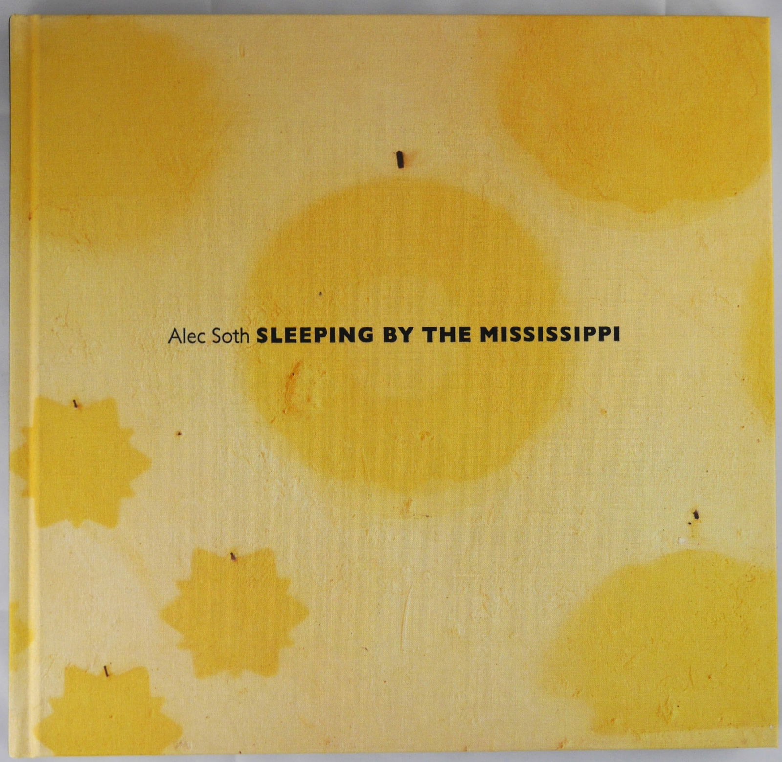Soth, Alec; Sleeping by the Mississippi [SIGNED - 2017 FOURTH EDITION - FINE]: Mack, 2017. Hardcover in yellow cloth boards. Fourth Edition. 11 x 11 1/2 inches and has 120 pages with 46 color plates. SIGNED by Alec Soth on the title page. BOOK CONDITION: Fine/As New; a tight, cl
