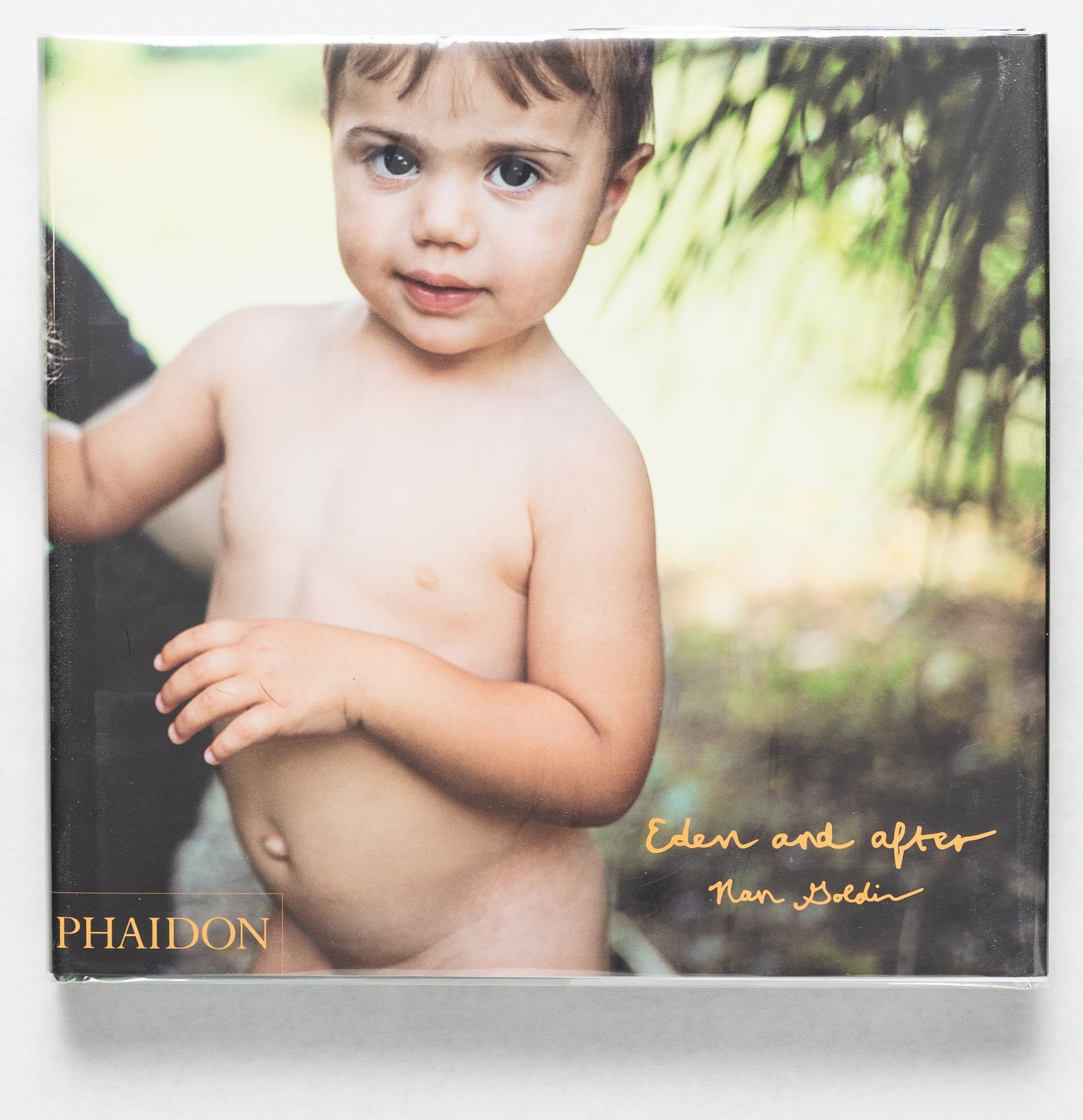 Goldin, Nan; Eden and After [SIGNED 1ST EDITION 1ST PRINTING - FINE]: Phaidon Press, 2014. Hardcover in pictorial dust jacket. First Edition, First Printing. Large, Oblong 4to. 380 pages filled with color photographic images by Nan Goldin throughout offering a new colle