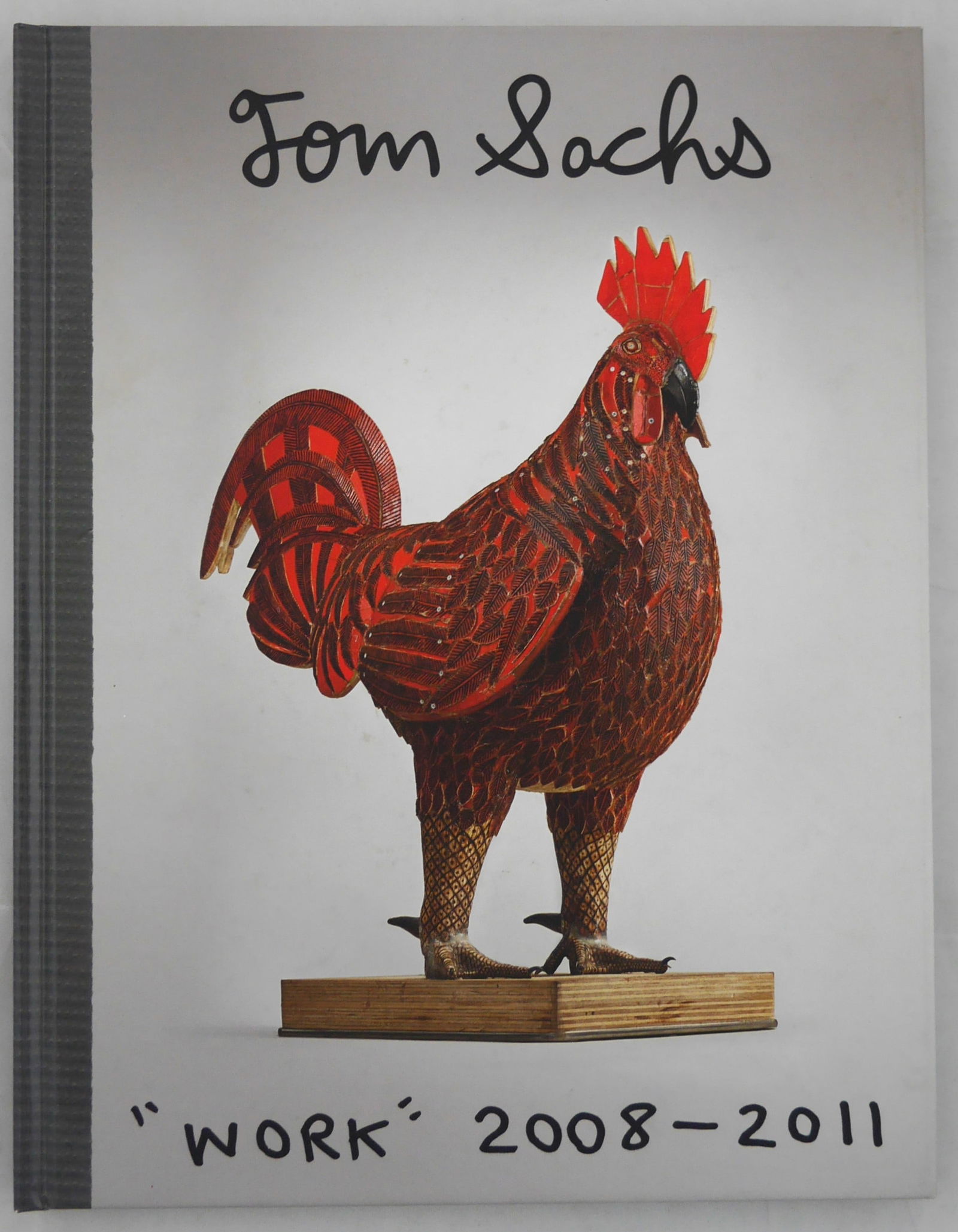 Sachs, Tom; Tom Sachs "Work" 2008-2011 [2012 1ST EDITION 1ST PRINTING - FINE]: New York: Sperone Westwater, 2012. Hardcover in pictorial boards. First Edition, First Printing. 4to. 11 x 8.5 inches. 120 pages profusely illustrated with color and b&w photograohic images throughout