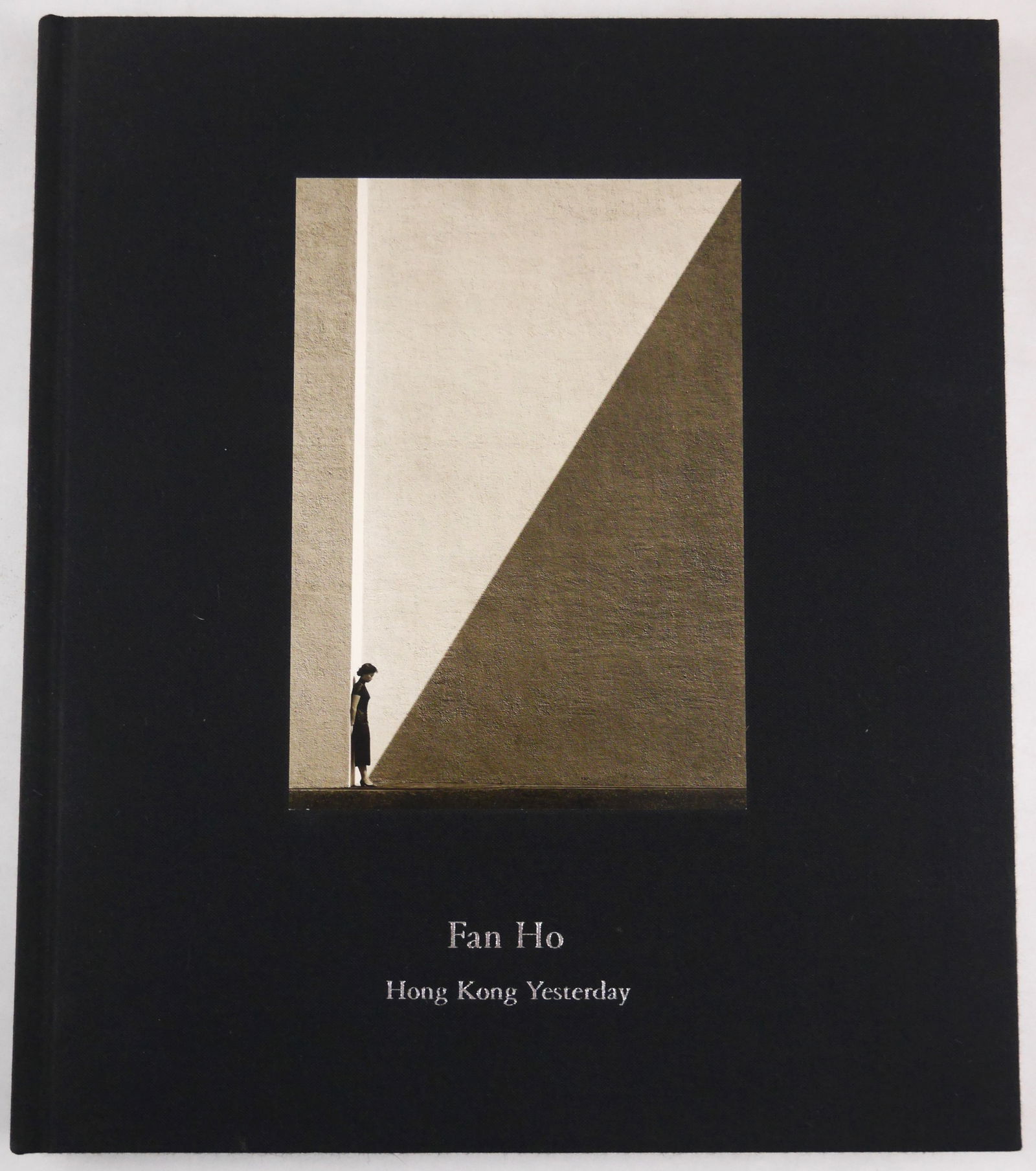 Fan Ho, Hong Kong Yesterday [2006 1ST EDITION, 1ST PRINTING]: Modern Book, 2006. Hardcover in cloth boards with tipped-in photograph to front cover. First Edition, First Printing. Text in English. 112 pages with 70 photographic images showcasing Fan Ho’s i