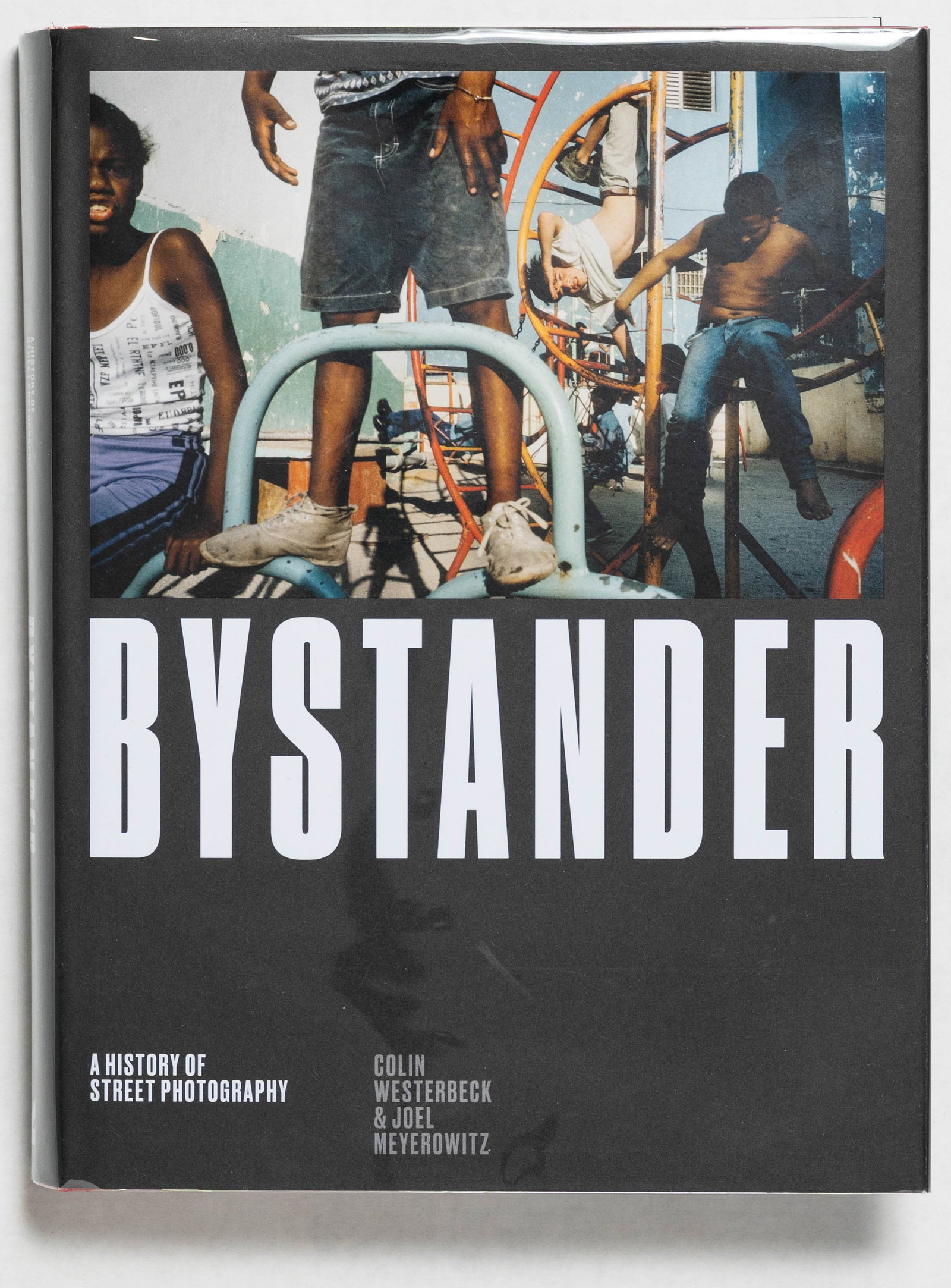 Meyerowitz, Joel [SIGNED]; Westerbrook, Colin; Bystander: A History of Street Photography: London: Laurence King Publishing, 2017. Hardcover in pictorial dust jacket. Later Edtion. 4to. 400 pages profusely illustrated throughout with color and blck and white photographs. SIGNED by Joel Meye