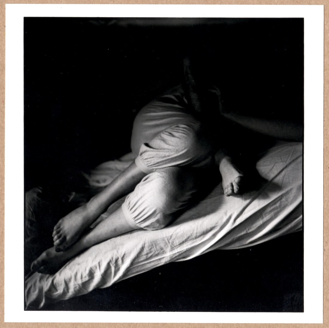 SIGNED - ELLIOTT ERWITT INTIMATE PORTRAIT OF LEGS ON A BED 6" x 6" MAGNUM PRINT: Description: 6"x 6" limited edition Fuji Crystal Archival Matte paper print. Image size is 5.5" on the longest side and the paper size is 6" x 6". The Print is SIGNED by Elliott Erwitt on the verso.Co