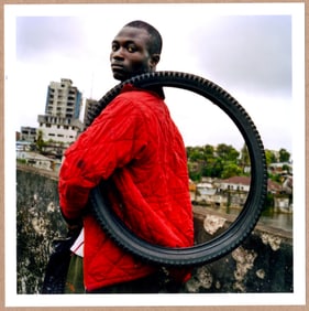 ESTATE STAMPED - TIM HETHERINGTON BOY WITH A FIRESTONE TIRE - LTD 6" x 6" MAGNUM ARCHIVAL PRINT