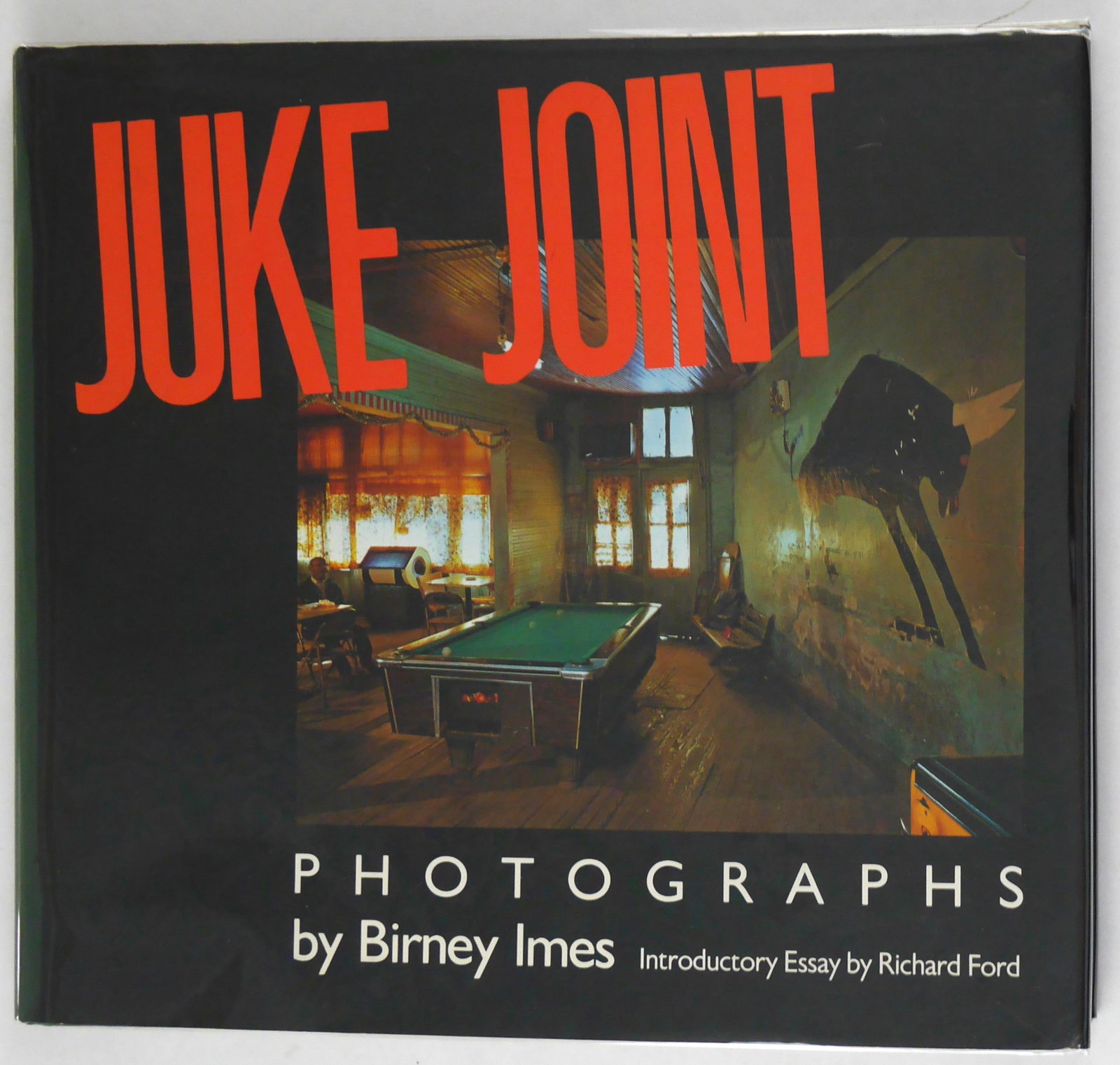 Imes, Birney; Juke Joint [SIGNED 1990 1ST EDITION 1ST PRINTING]: University Press of Mississippi, 1990. Hardcover in pictorial dust jacket. First Edition, First Printing. 125 pages illustrated with 58 full-page color photographic images throughout by Birney Imes of