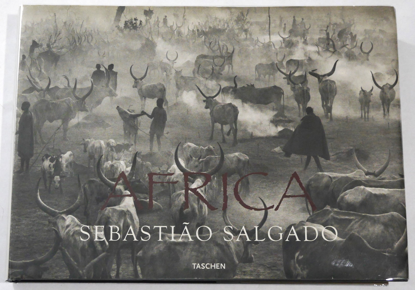 Salgado, Sebastiao; Africa [SIGNED - 2007 1ST EDITION & 1ST PRINTING]: SIGNED COPY Taschen, 2007. Hardcover in pictorial dust jacket. First edition, First Printing. Oblong quarto. 335 pages with numerous black and white photographic images throughout. SIGNED by Sebastiao