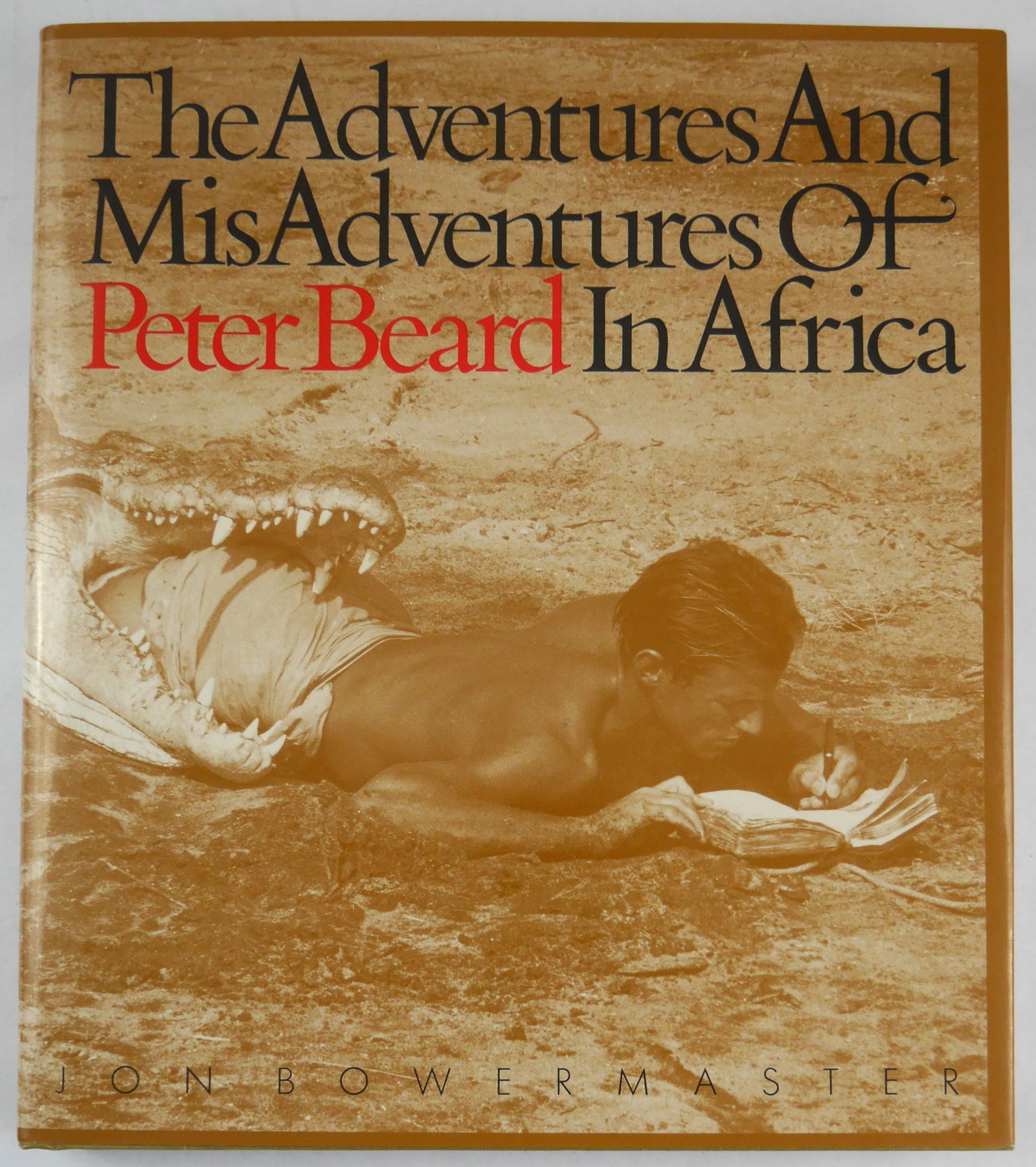 Beard, Peter [SIGNED & EMBELLISHED]; Bowermaster, Jon; Adventures and Misadventures of Peter Beard: SIGNED COPY Boston, MA: Bullfinch Press/Little Brown & Co., 1993. Hardcover in pictorial dust jacket. First Edition, First Printing. An illustrated biography of photographer Peter Beard. Includes nume
