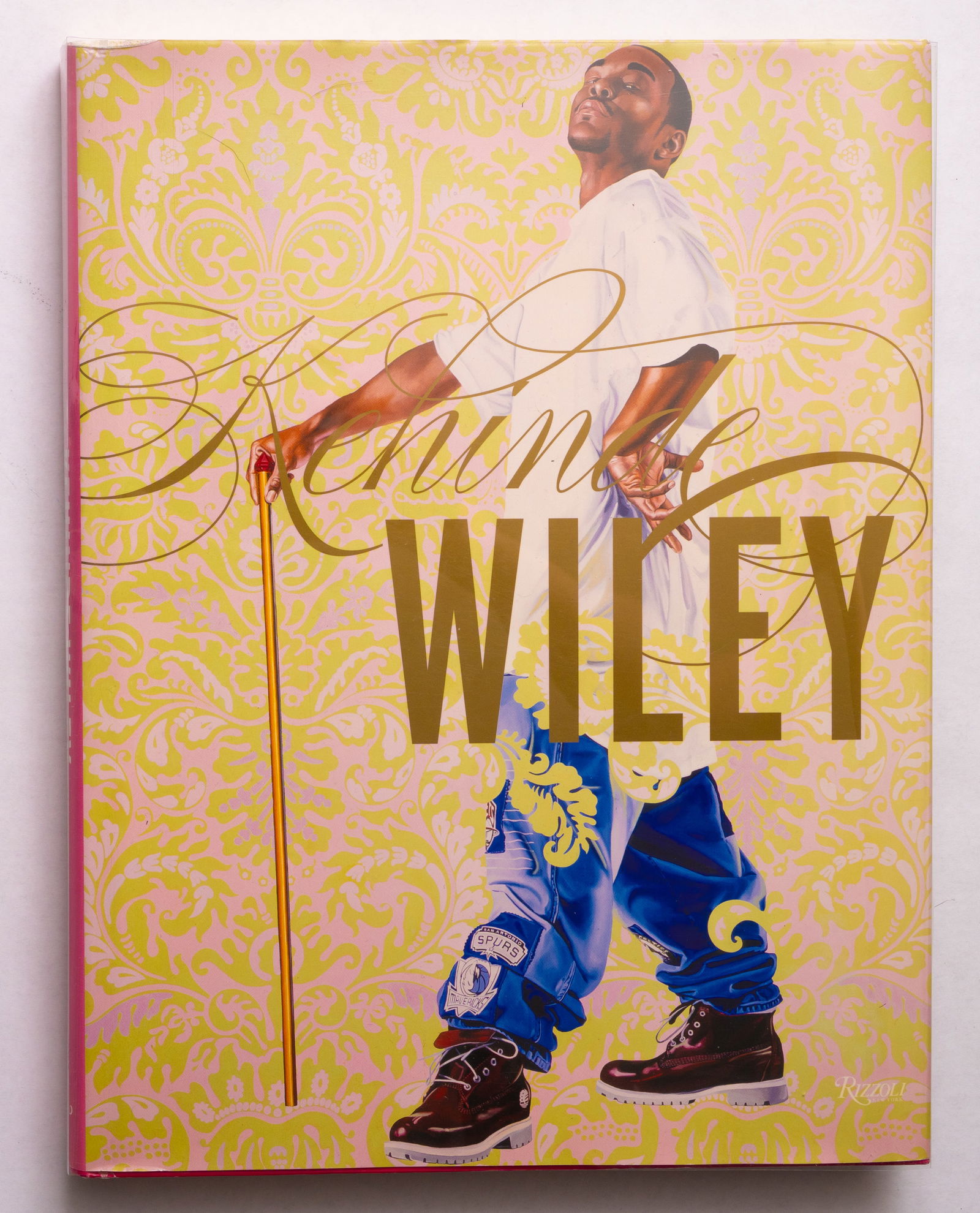 Kehinde Wiley [SIGNED 2012 RIZZOLI MONOGRAPH 1ST ED 1ST PRINT - FINE]: SIGNED COPY - New York, Rizzoli, 2012. Hardcover with gilt edges in pictorial dust jacket. First Edition, First Printing with the full numberline ending on 1. 248 pages with numerous color illustratio