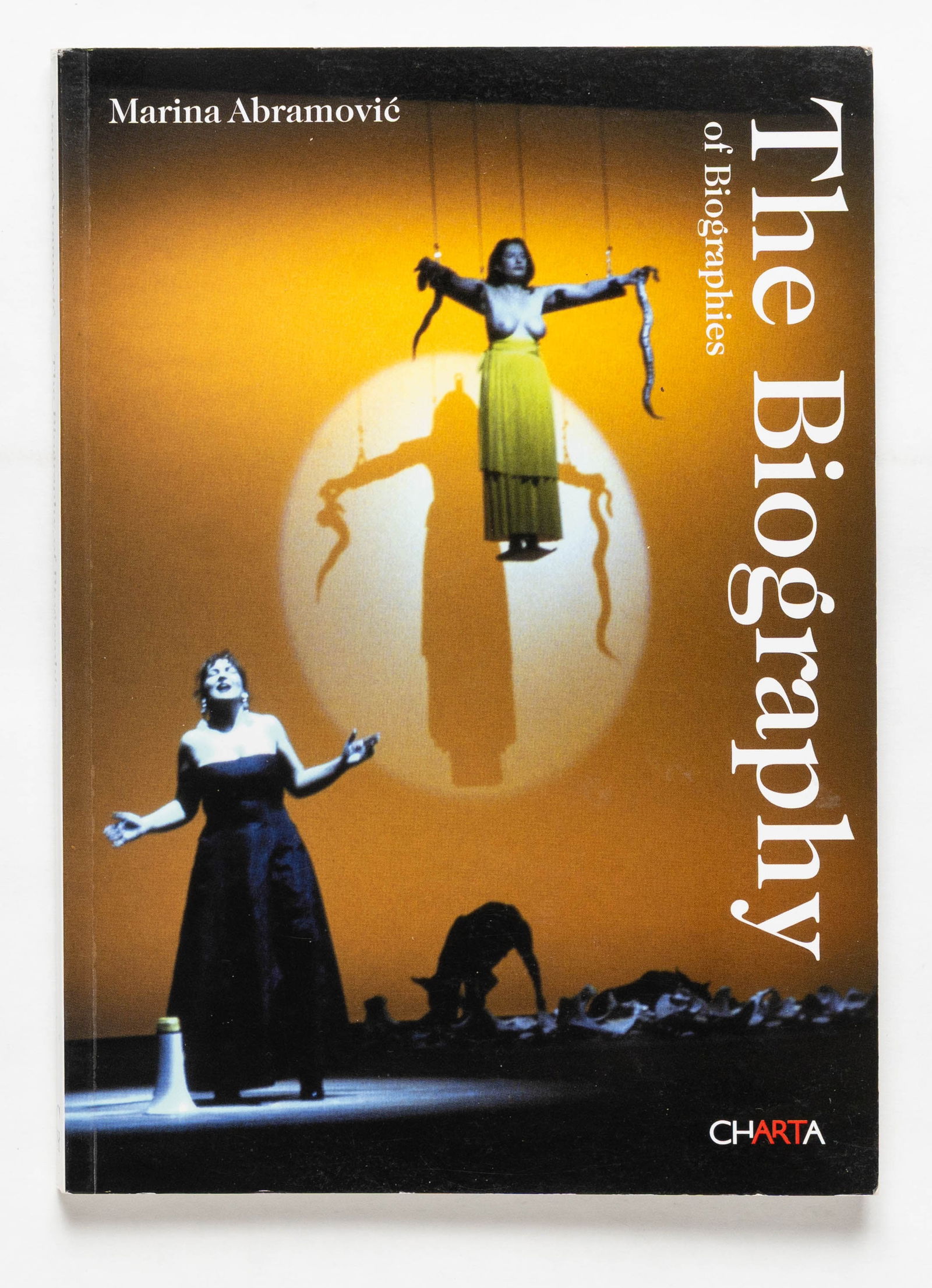 Marina Abramovic, The Biography of Biographies [SIGNED 2004 1ST EDITION]: SIGNED COPY - CHARTA, 2004. Softcover in pictorial wrappers. First Edition, First Printing. 5 x 4 inches. 128 pages with numerous photographic images throughout. Accompanying text in English. While em