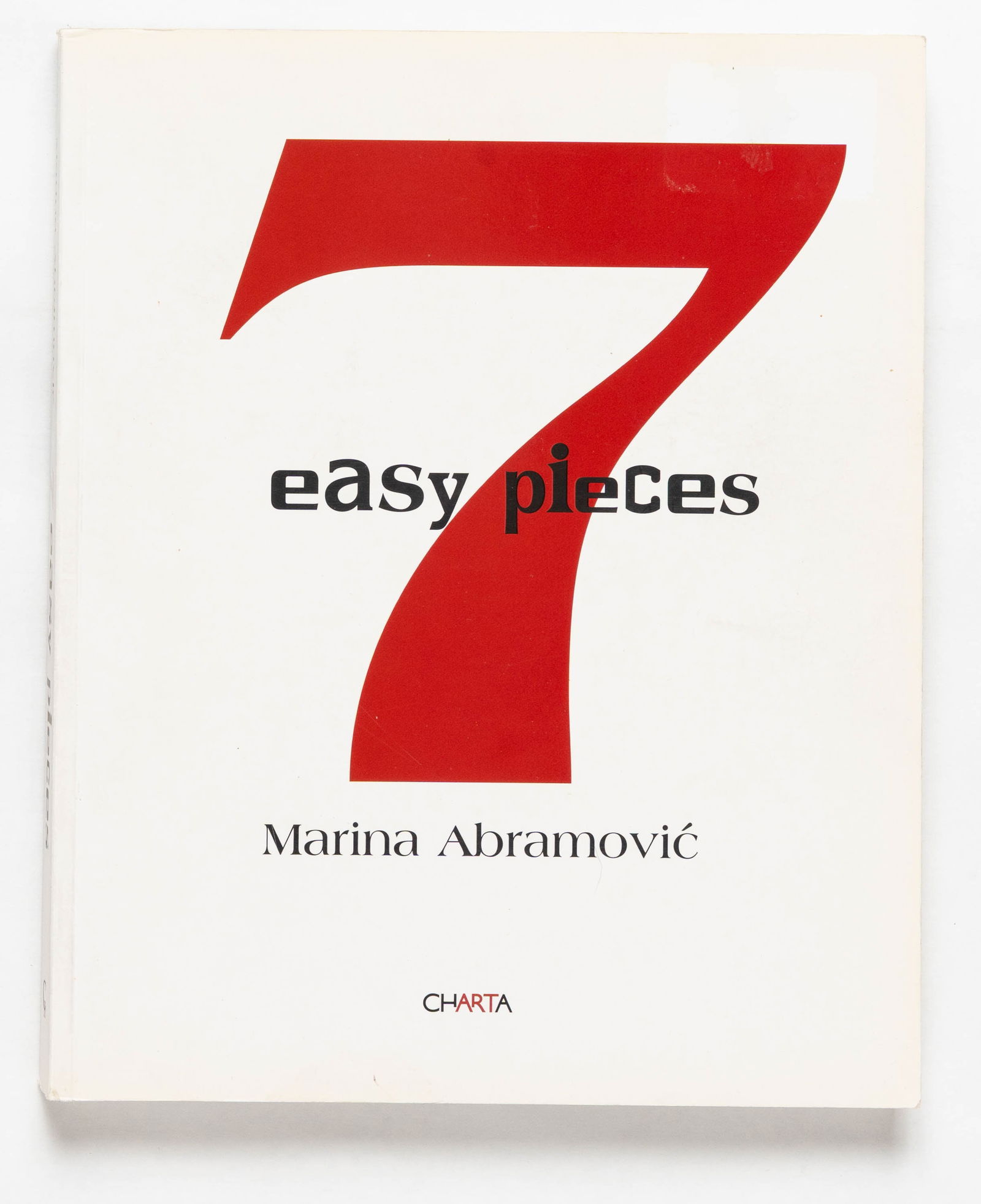 Marina Abramovic, 7/Seven Easy Pieces [SIGNED 1ST EDITION 1ST PRINTING]: SIGNED COPY - Charta, 2007. Softcover, 240 pages documenting Abramovic's landmark 2005 Guggenheim Museum commission. Over seven consecutive nights (November 9-15, 2005), she re-performed iconic, ephem