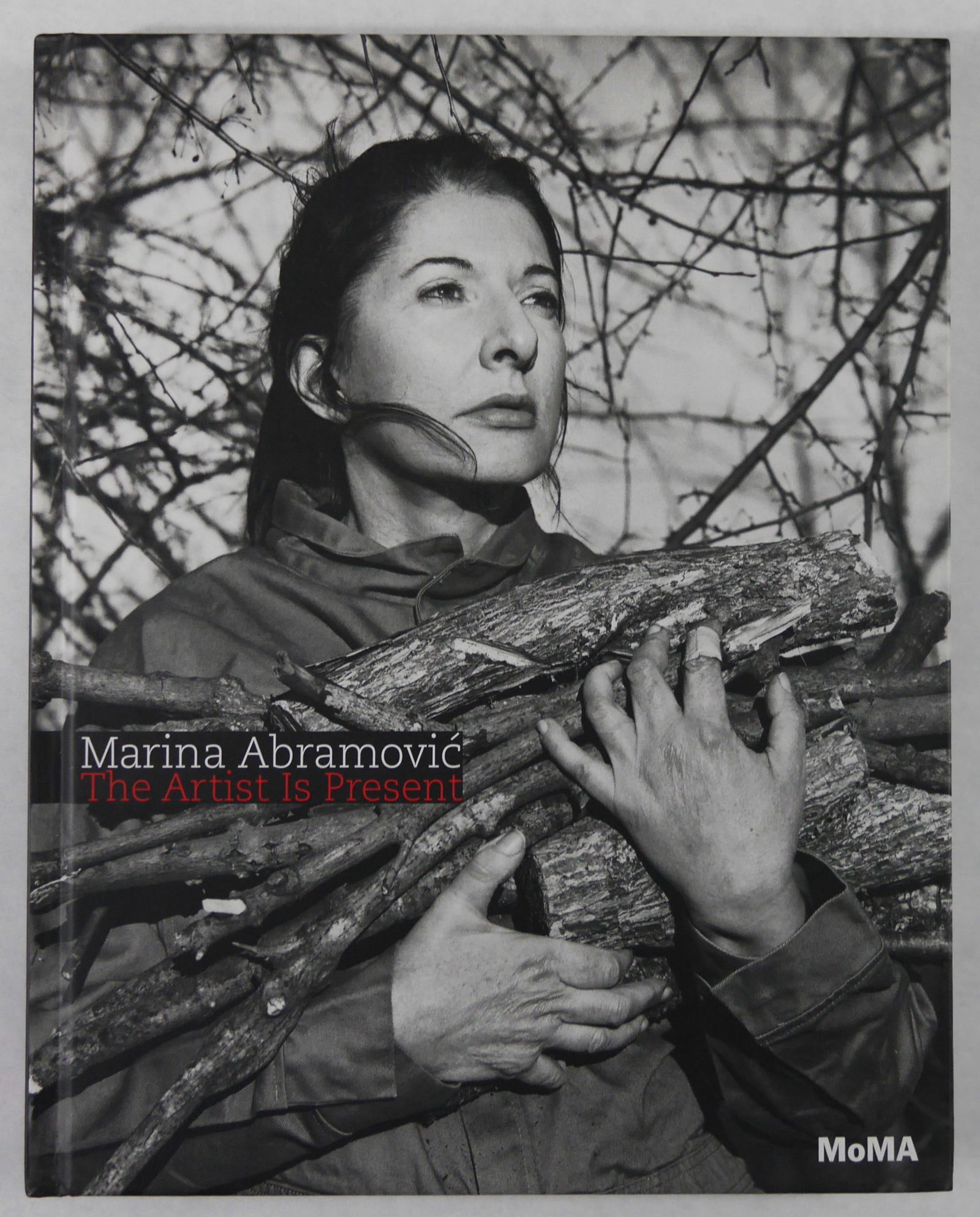 Marina Abramovic, The Artist is Present [SIGNED 2010 1ST ED 1ST PRINT - FINE]: SIGNED COPY - Museum of Modern Art, 2010. ardcover in pictoral boards with CD attached inside front cover. First Edition, First Printing. 12 x 9 inches. 227 pages with numerous photographic images and