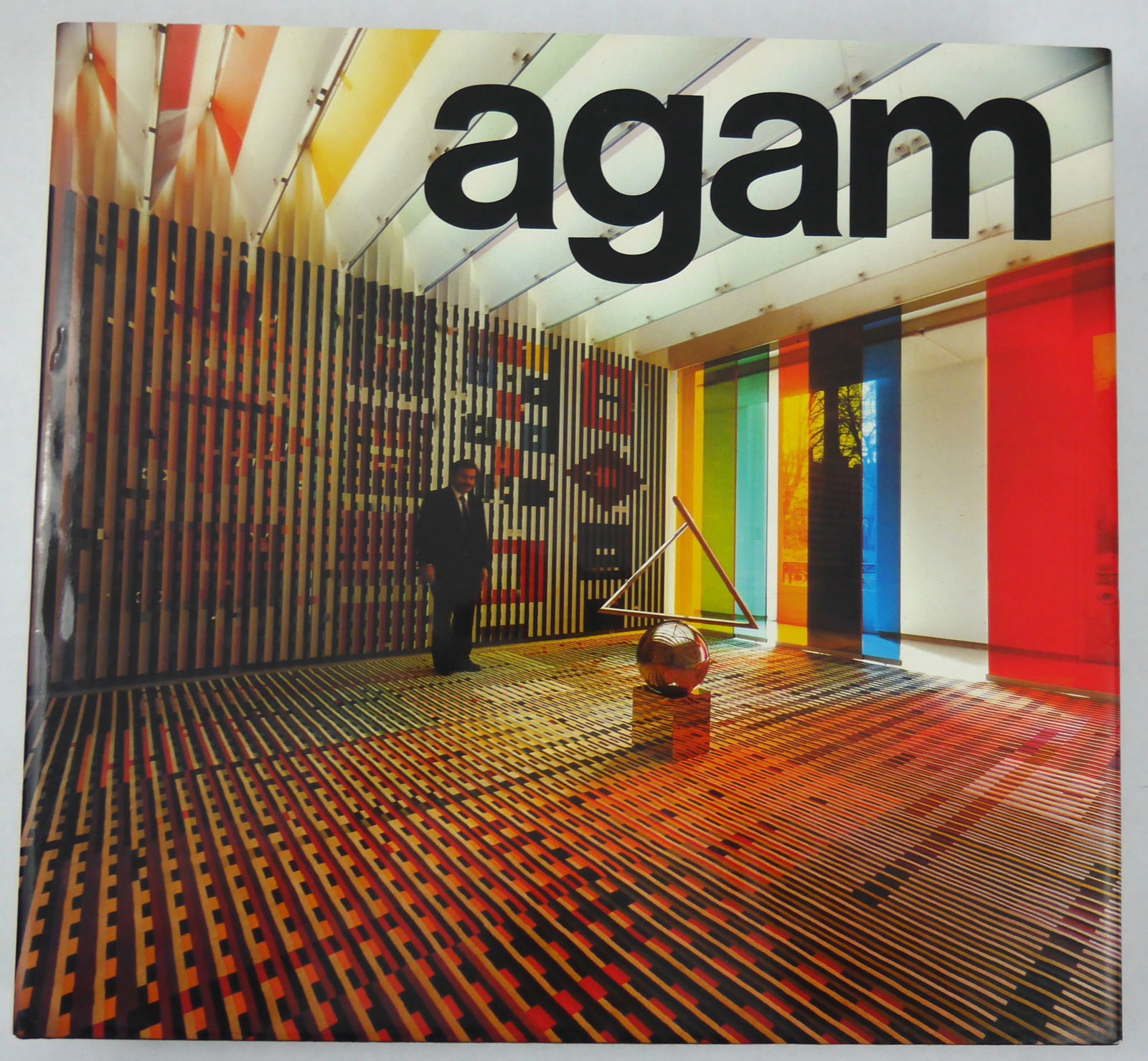 Agam, Yakov; Popper, Frank; Agam [SIGNED WITH A DESIGN - 1976 1ST EDITION 1ST PRINTING - FINE]: New York: Harry N. Abrams, Inc., Publishers, 1976, Hardcover in pictorial dust jacket. First Edition, First Printing. 12 x 14 inches. 354 pages, text interspersed with 488 photographic images and illu