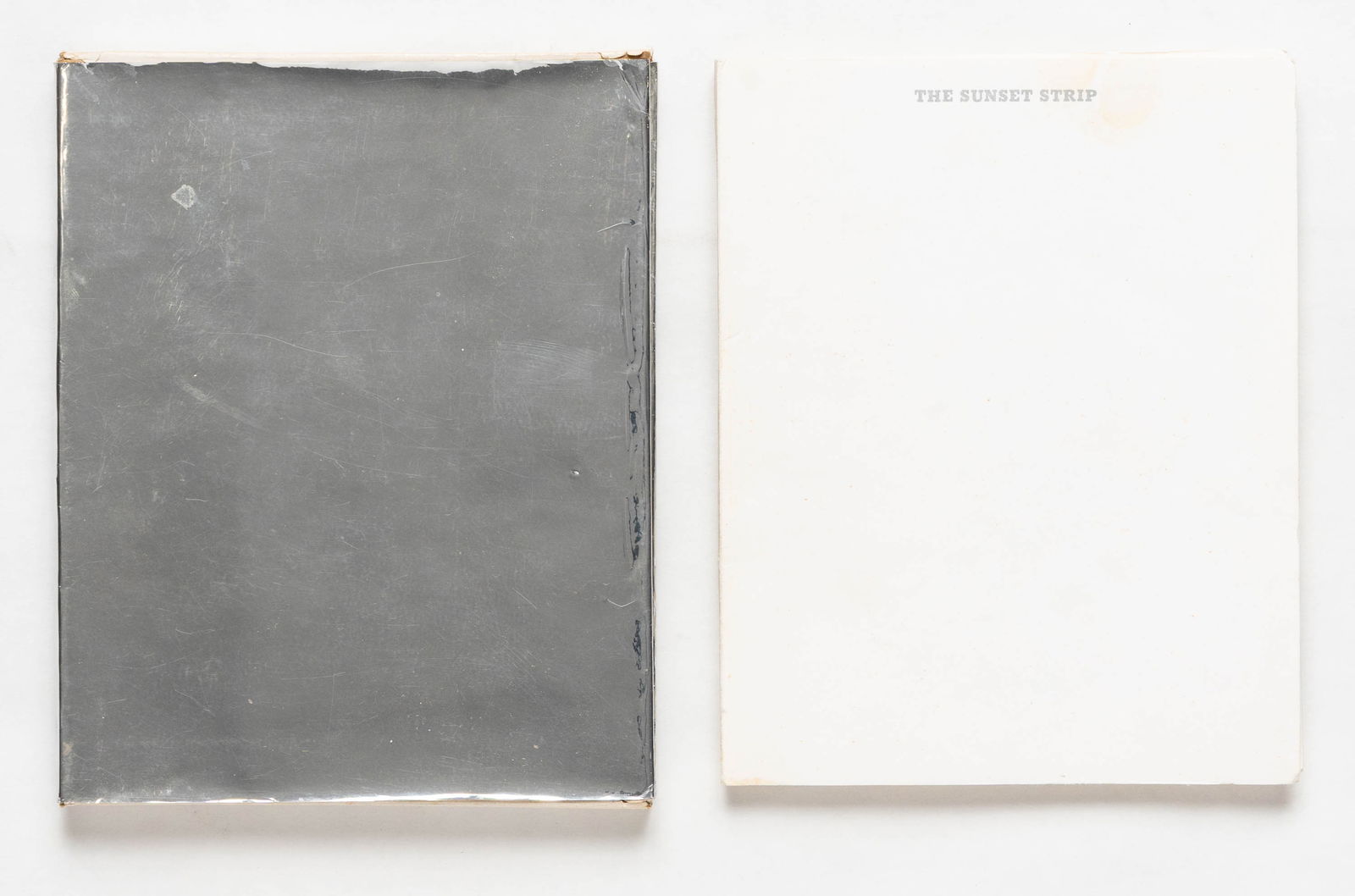 Ruscha, Ed; Sunset Strip [1966 1ST EDITION, 2ND PRINTING - WITHOUT THE EXTRA 2" FLAP - NICE COPY]: Los Angeles: Edward Ruscha, 1966. Softcover in slipcase. First Edition, Second Issue (without the extra flap). Unpaginated 27 foot accordion-fold, with numerous black-and-white panoramic plates printe