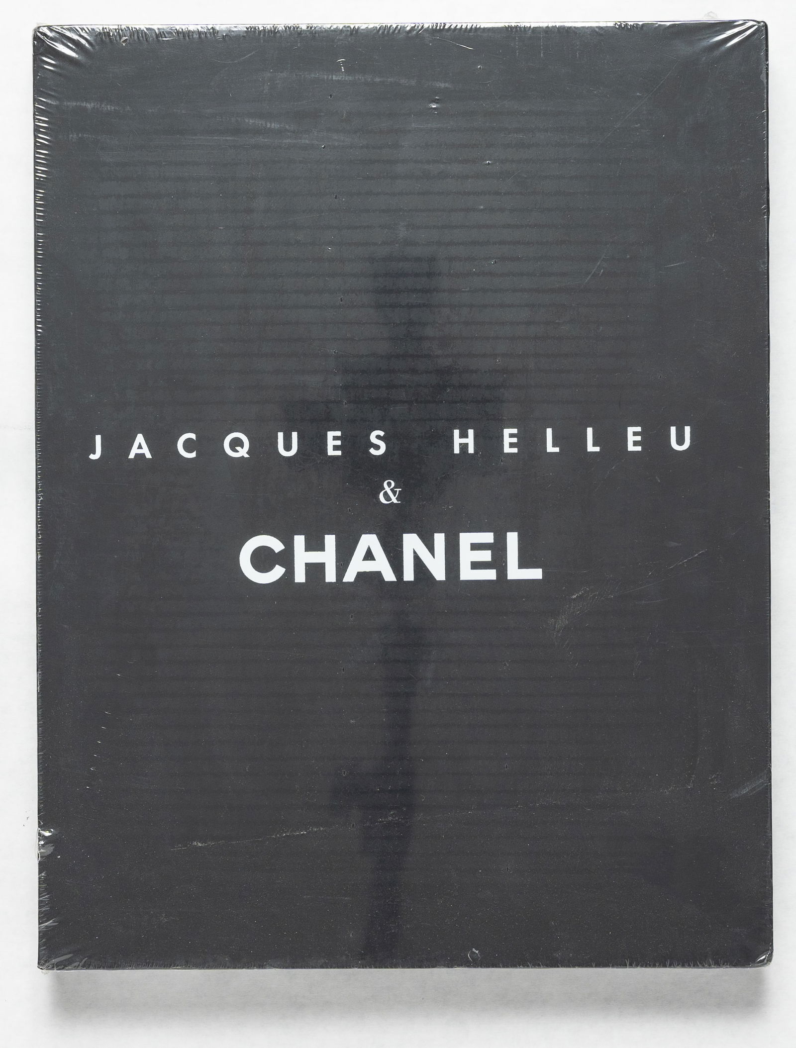 Jacques Helleu & CHANEL [2006 1AT EDITION IN SLIPCASE - FINE]: Harry N. Abrams, 2006. Hardcover in dust jacket housed in slipcase. First Edition, First Printing. 14 1/2" x 11 1/4". 279 pages with numerous photographic images and illustrations throughout. BOOK CON