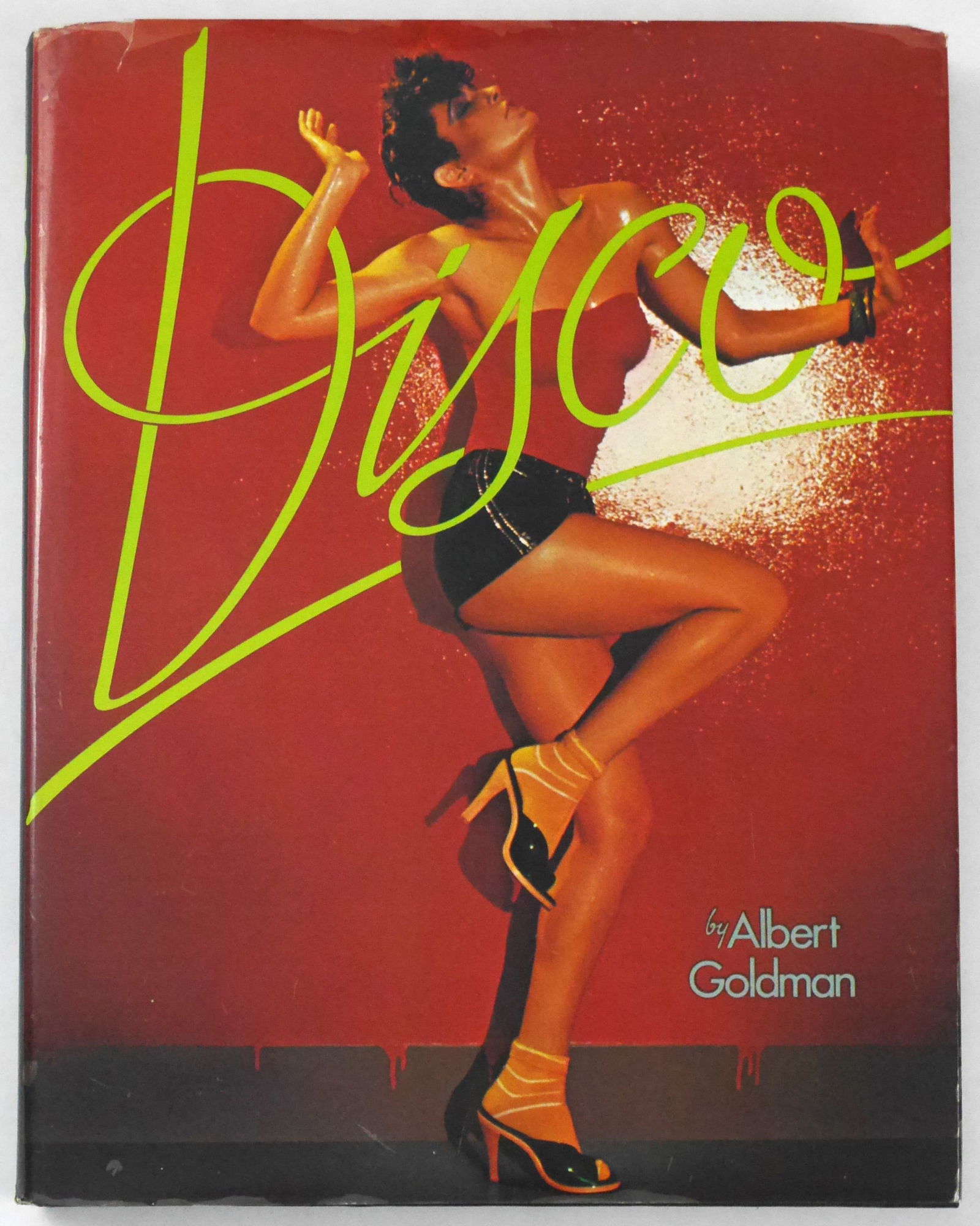 Goldman, Albert; Disco [1978 1ST EDITION & 1ST PRINTING HARDCOVER WITH DUST JACKET - NICE COPY]: Hawthorne Books, New York, 1978. Hardcover in pictorial dust jacket. First Edition, First Printing (with the complete number line ending in 1). 174 pages with numerous color and black and white photog