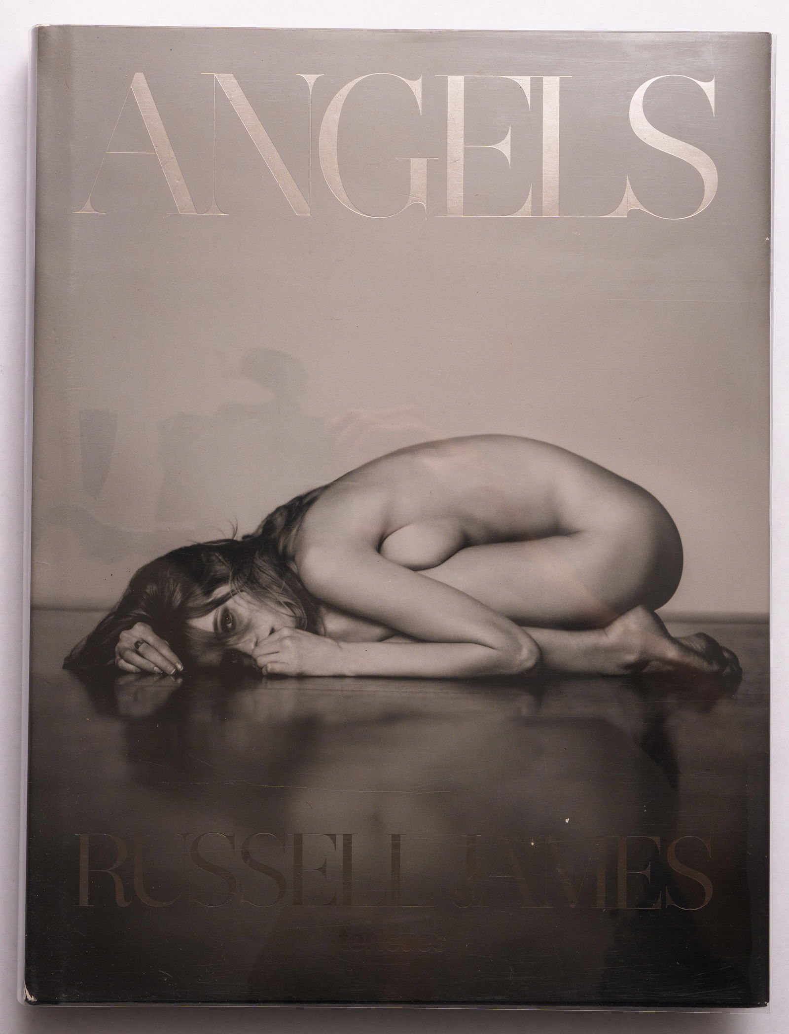 Russell James, Angels (Victoria's Secret Models) [2014 1ST EDITION - FINE]: teNues, 2014. Hardcover in pictorial dust jacket. First Edition, First Printing. 15 x 12 inches. Unpaginated with circa 300 pages and 174 full-page photographic images throughout. The Victoria's Secre