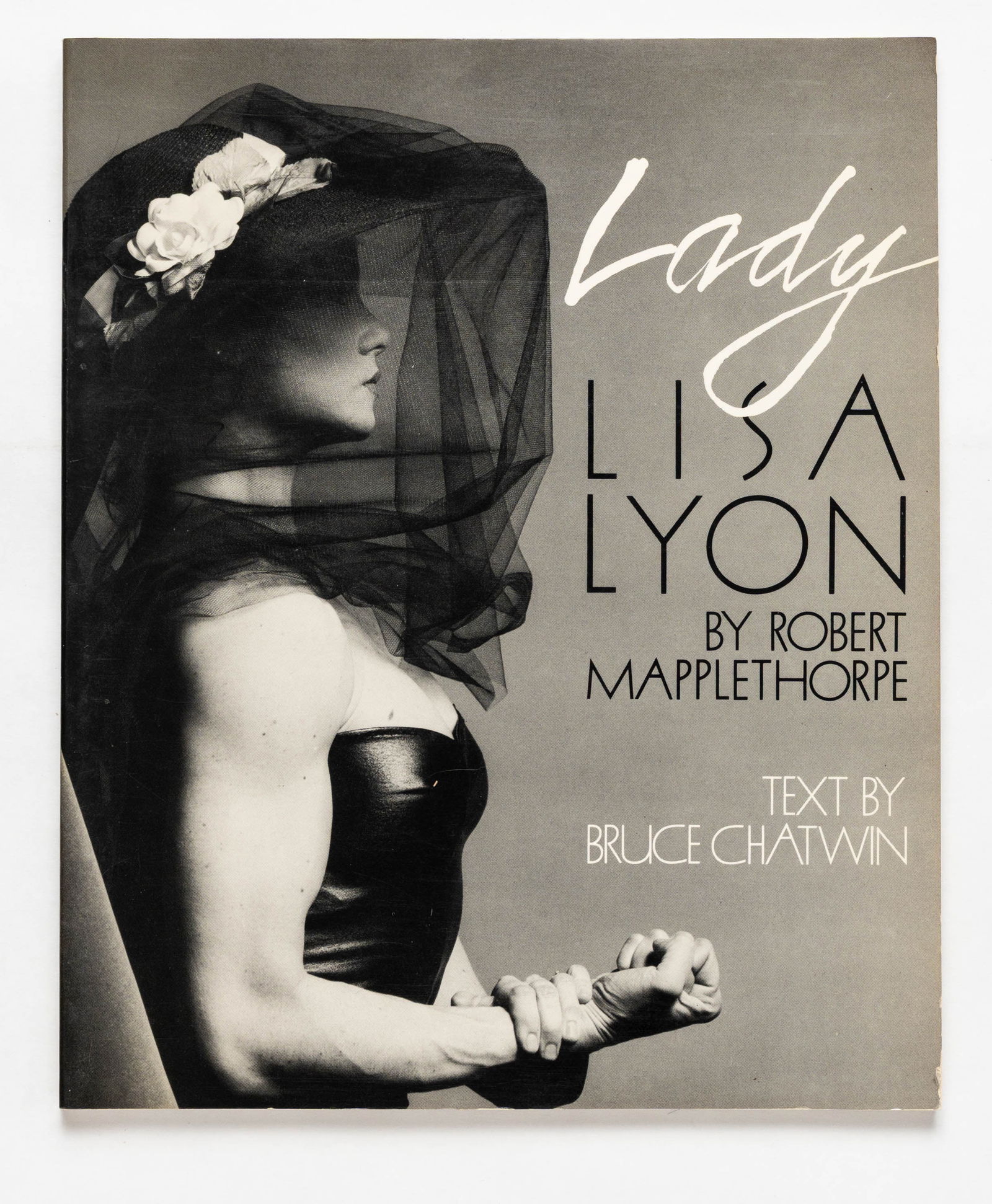 Mapplethorpe, Robert; Lady Lisa Lyon [1983 1ST EDITION - FINE COPY]: New York: The Viking Press (A Studio Book), 1983. Softcover in pictorial wrappers. First Edition, First Edition. 128,pages with over 100 black-and-white photographic images; text by Bruce Chatwin; for