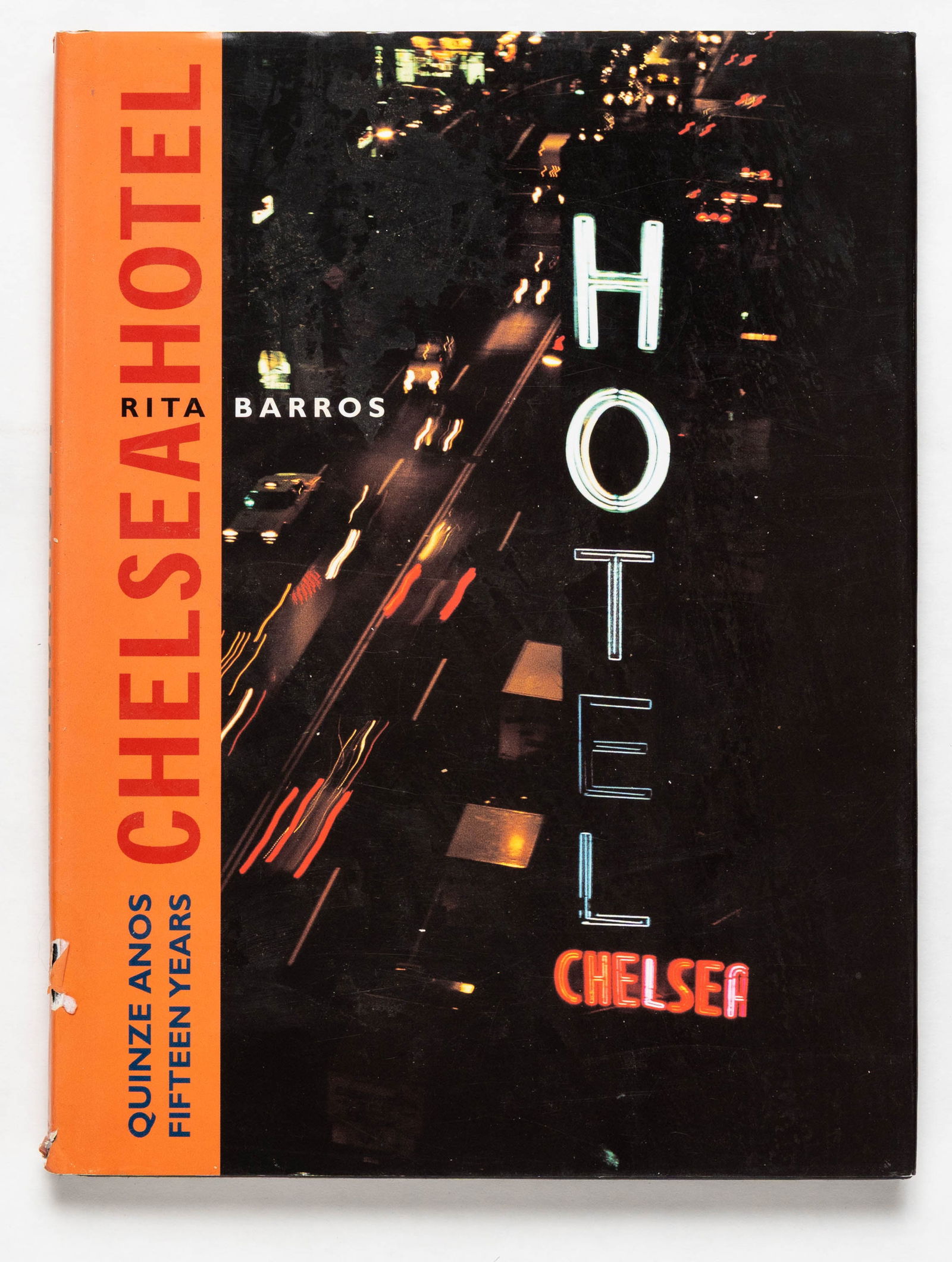 Barros, Rita; The Chelsea Hotel, Fifteen Years / Quinze Anos: Edicao da Camara Municipal de Lisboa, 1999. Hardcover in pictorial dust jacket. First Edition (stated), First Printing. Limited Edition. 120 pages with numerous color photographic images throughout by