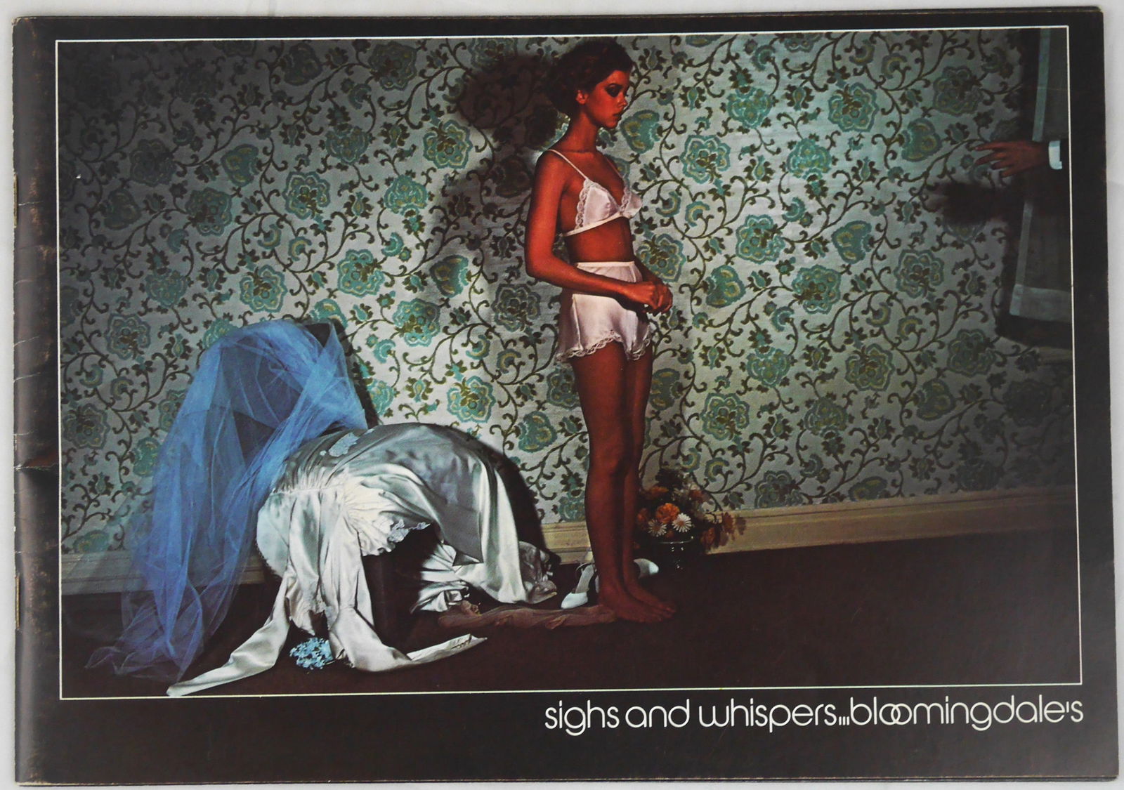 Bourdin, Guy; Sighs and Whispers - Bloomingdales 1976 Lingerie Catalogue: New York: Bloomingdale's. 1976. Softcover in pictorial wrappers. 36 unnumbered pages, with numerous color photographic images by Guy Bourdain throughout. BOOK CONDITION: Fine; a solid, tight, clean co