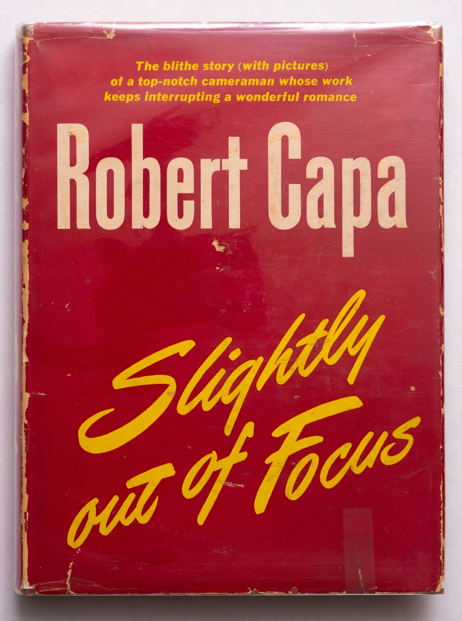 Capa, Robert; Slightly Out of Focus [1947 1ST EDITION WITH DUST JACKET - NICE COPY]: Henry Holt and Co., New York, 1947. Hardcover in printed red dust jacket. First edition, first printing. 244 pages with 118 black and white photographic images throughout. Cited in Martin Parr, The ph