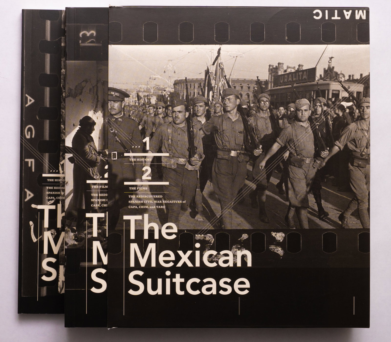 Capa, Robert; Chim [Seymour, David]; Taro, Gerda; The Mexican Suitcase: New York, ICP International Center of Photography / Göttingen, Steidl, (2010).2 softcover volumes housed in thin paper slipcase. First Edition. Vol 1 with 192 pages. Vol 2 with 400 pages. With essays