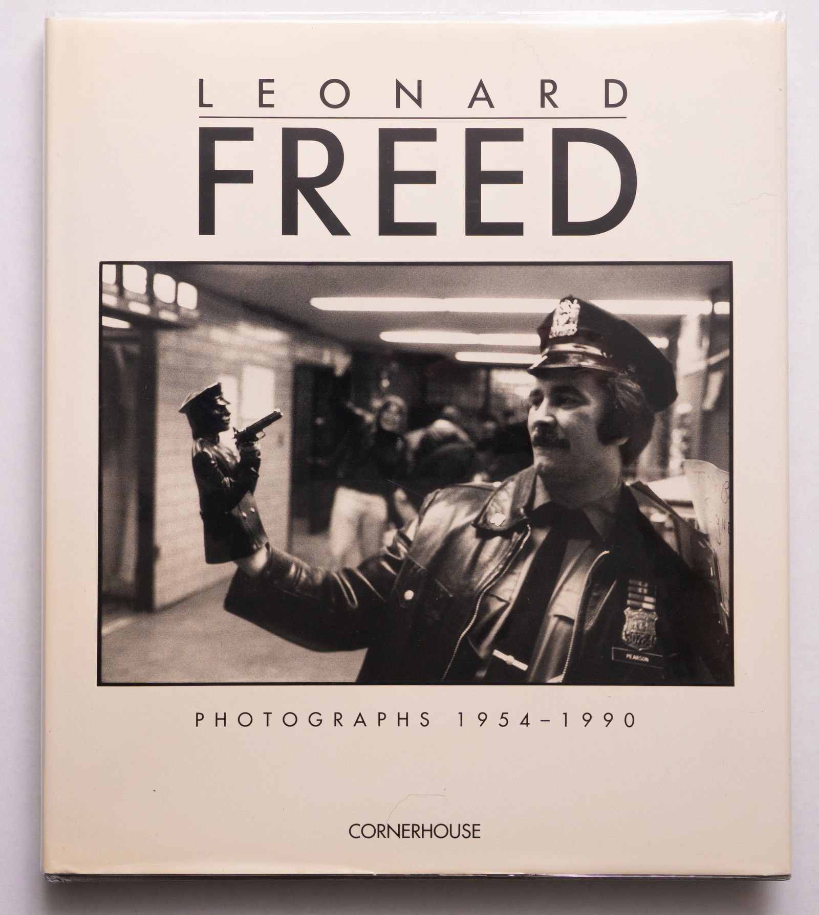 Leonard Freed, Photographs 1954-1990 [SIGNED 1ST EDITION - FINE COPY]: Cornerhouse, 1991. Hardcover in pictorial dust jacket. First Edition, First Printing (published simultaneously with the first French edition, 1991). 195 pages filled with numerous black and white phot