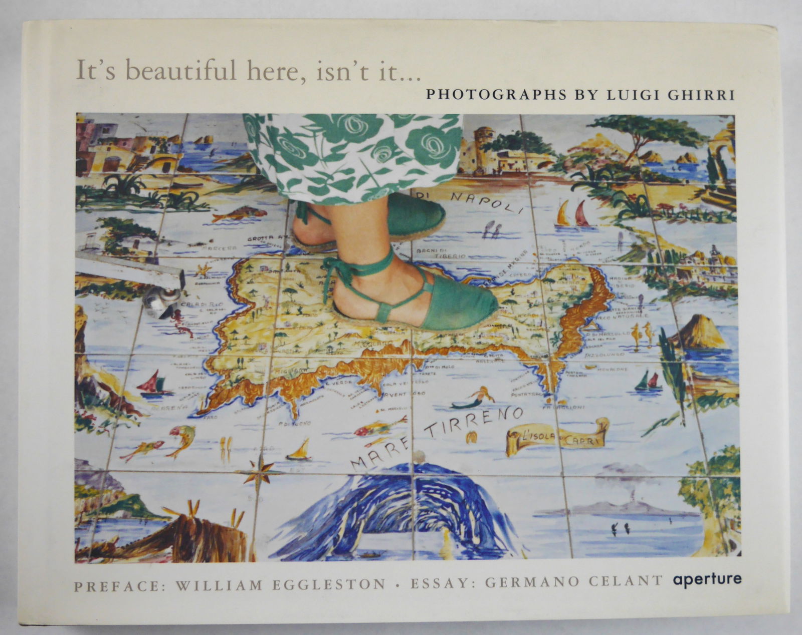 Ghirri, Luigi; It's Beautiful Here Isn't It? [2008 APERTURE 1ST EDITION & 1ST PRINTING - FINE COPY]: Aperture, 2008. Hardcover in pictorial dust jacket. First Edition, First Printing (with a full numberline ending in 1). 152 pages with numerous color photographic images throughout by Luigi Ghirri. A