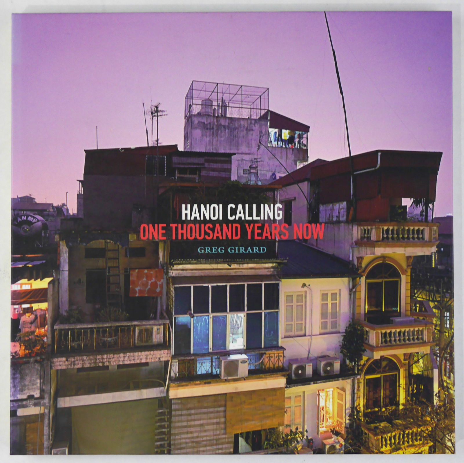Girard, Greg; Hanoi Calling: One Thousand Years Now [2010 1ST EDITION 1ST PRINTING - FINE]: Magenta Foundation, 2010. Hardcover in pictorial boards. First Edition, First Printing. 123 pages with 76 color photographic images throughout. BOOK CONDITION: Fine; a solid, tight, cllean copy showin